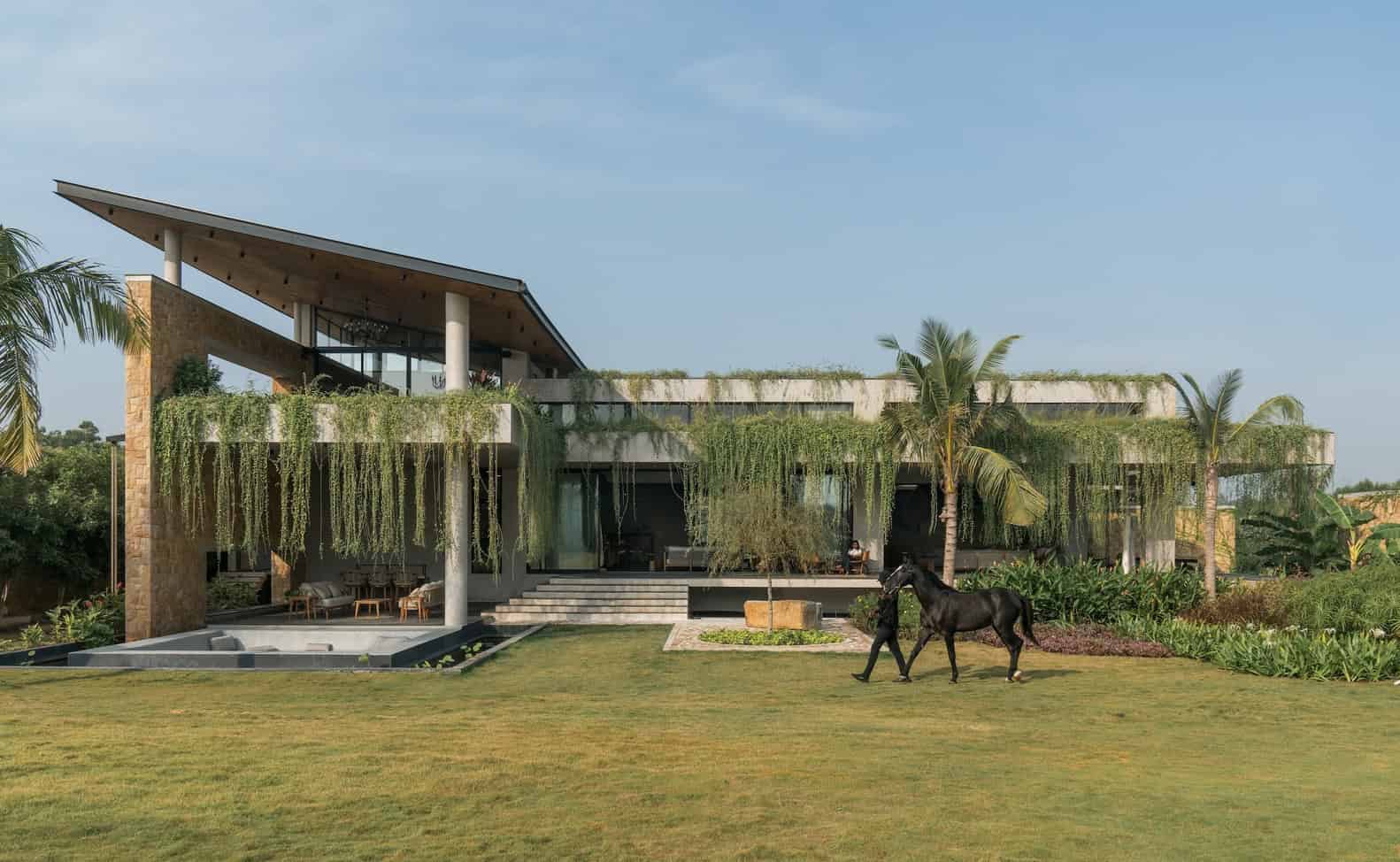 Antriya House Main Facade Green Curtain by 23 Degrees Design Shift Antriya House by 23 Degrees Design Shift — main facade draped with a green curtain of vines, Hyderabad, India