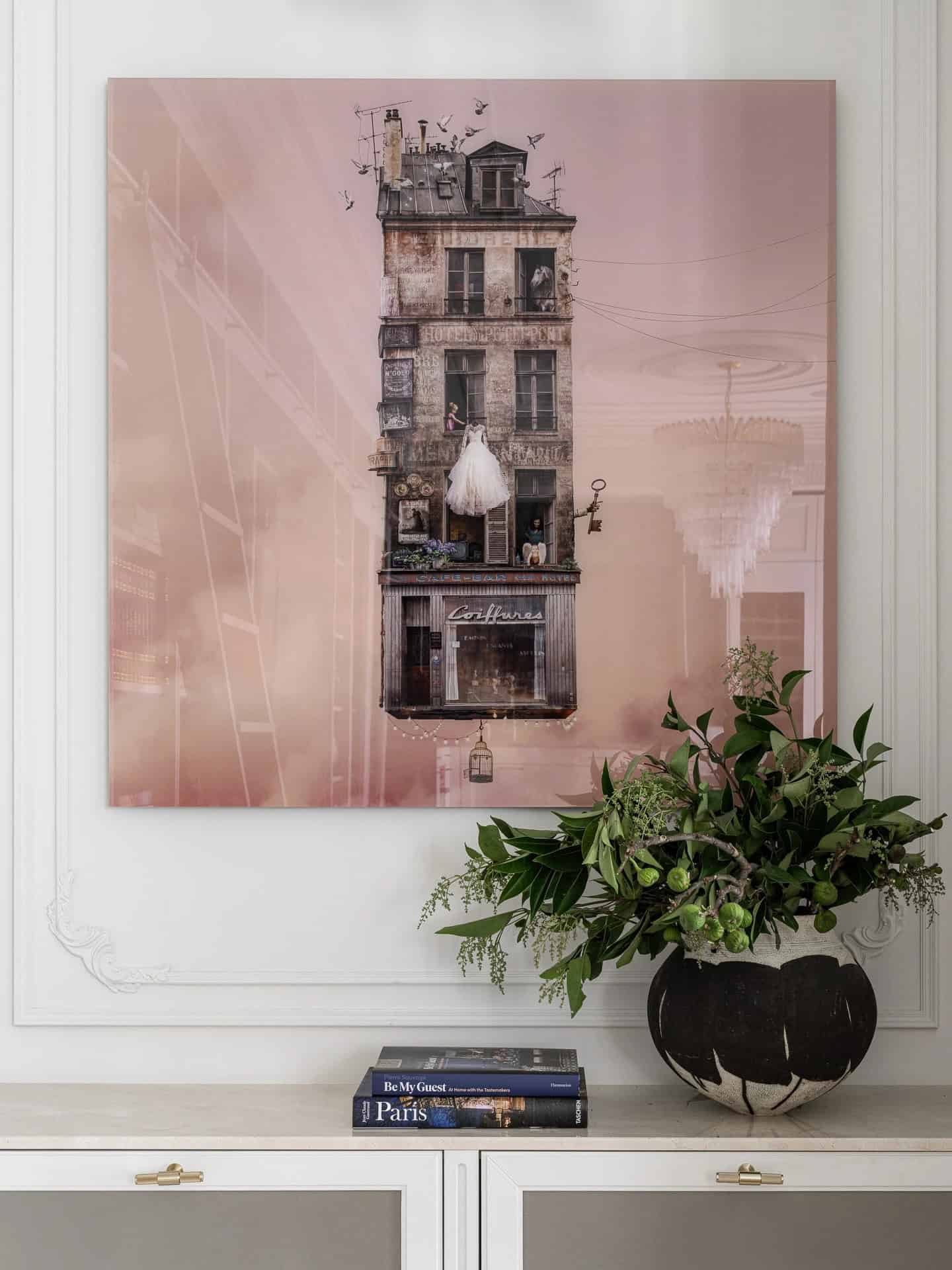 Apartment with a Parisian Mood for Collectors Artwork Vignette by AABA Architects Artwork vignette with floral arrangement and books in the Apartment with a Parisian Mood for Collectors by AABA Architects, Moscow