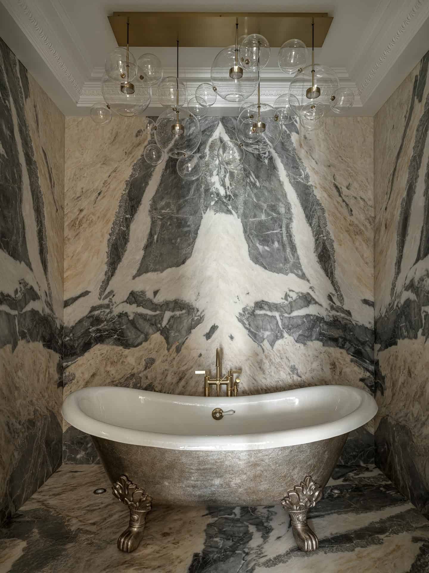 Apartment with a Parisian Mood for Collectors Bathroom Freestanding Tub by AABA Architects Bathroom with freestanding metallic clawfoot tub and marble walls — AABA Architects, Moscow