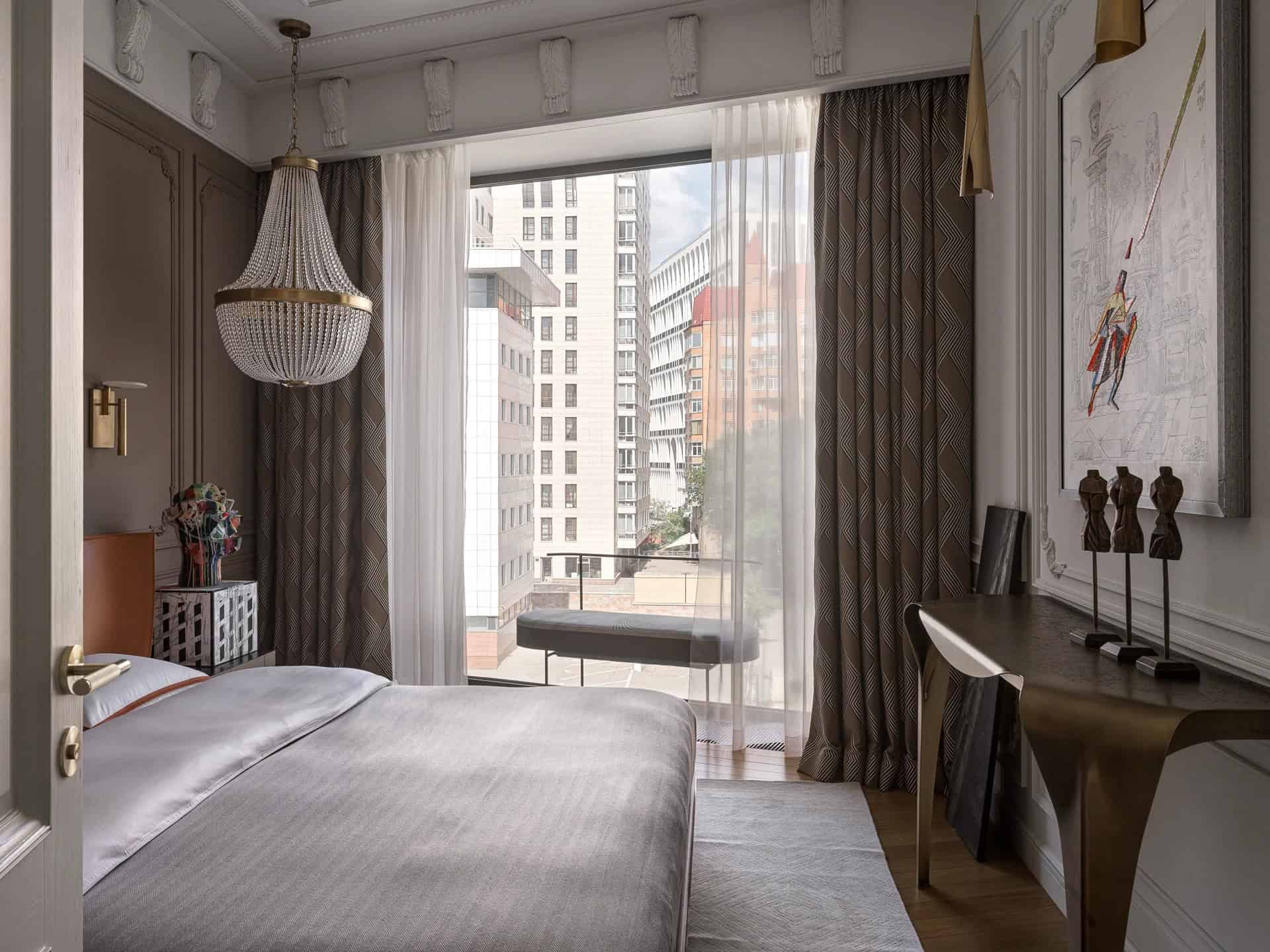 Apartment with a Parisian Mood for Collectors Bedroom Chandelier Window by AABA Architects Bedroom with beaded chandelier and large window — AABA Architects, Moscow
