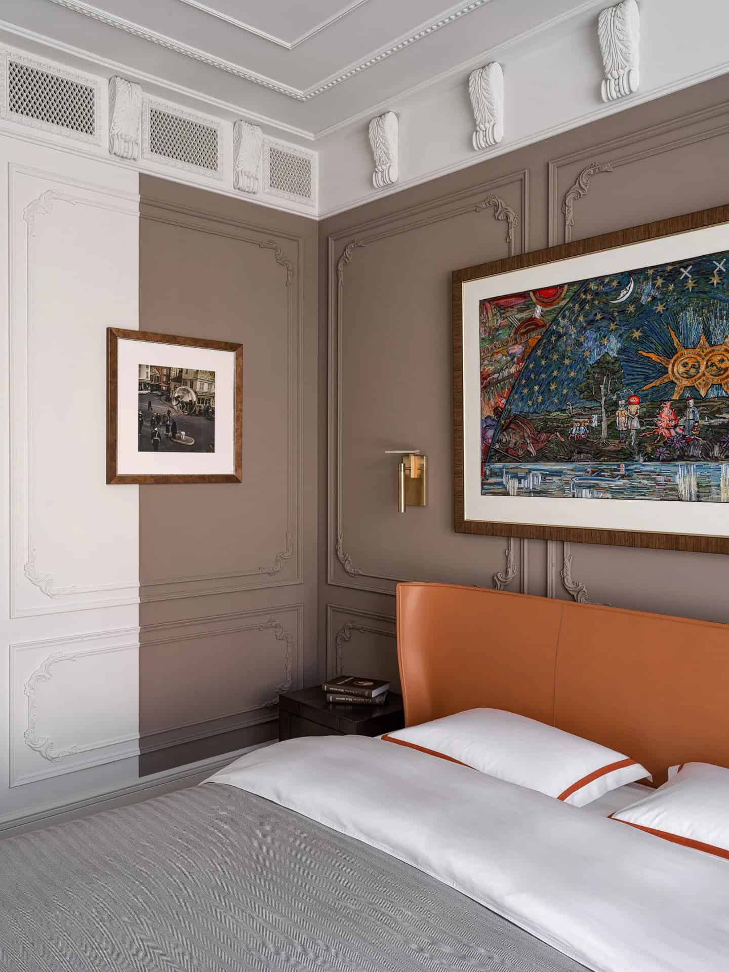 Apartment with a Parisian Mood for Collectors Bedroom Headboard Art by AABA Architects Detailed wall molding and artwork over leather headboard — AABA Architects, Moscow
