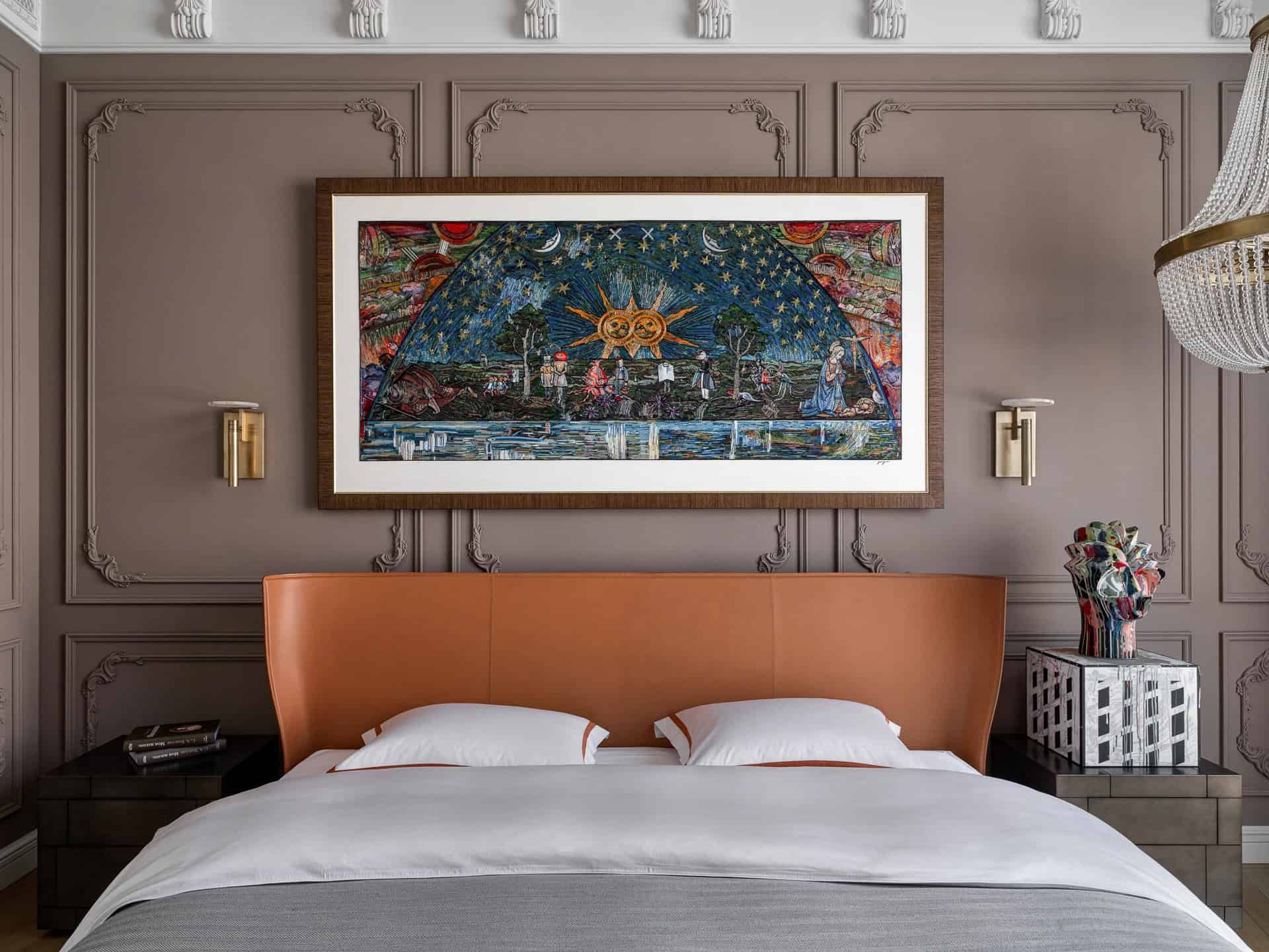 Apartment with a Parisian Mood for Collectors Bedroom Headboard Wide by AABA Architects Wide view of bedroom feature wall with large artwork and chandelier — AABA Architects, Moscow