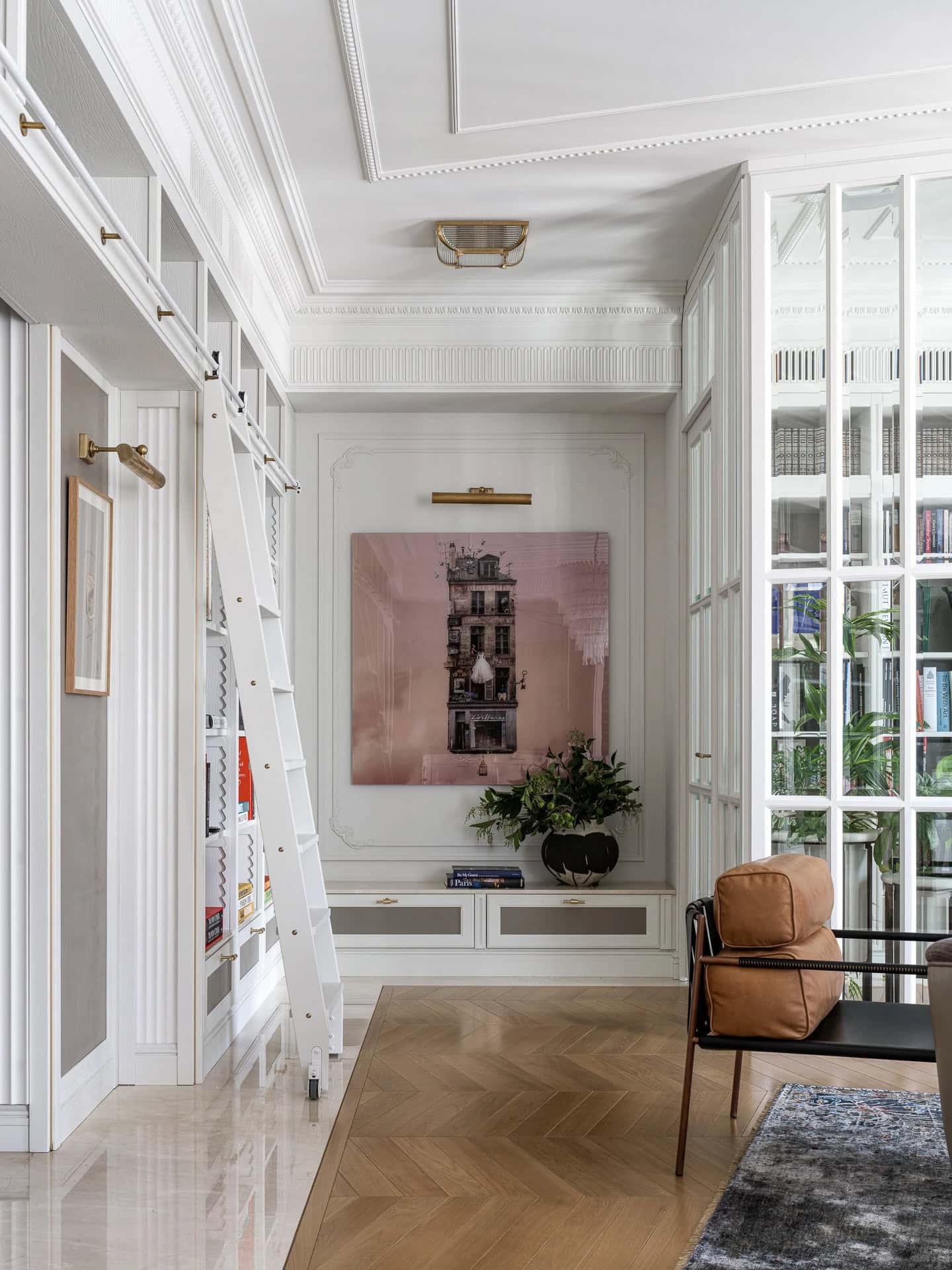 Apartment with a Parisian Mood for Collectors Gallery Wall and Ladder by AABA Architects Gallery wall with library ladder and classic molding in the Apartment with a Parisian Mood for Collectors by AABA Architects, Moscow