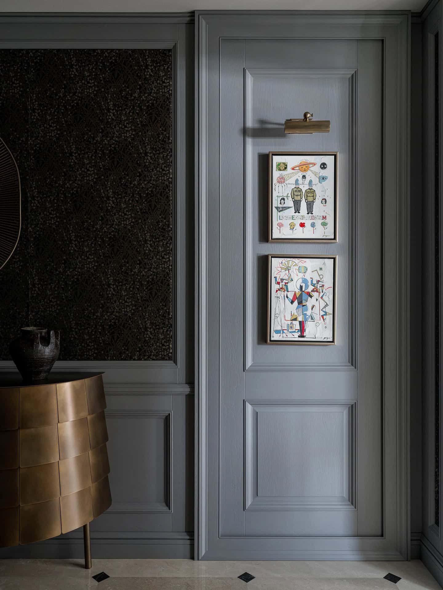 Apartment with a Parisian Mood for Collectors Hallway Art Detail by AABA Architects Hallway wall art framed in gray paneling with brass light — AABA Architects, Moscow