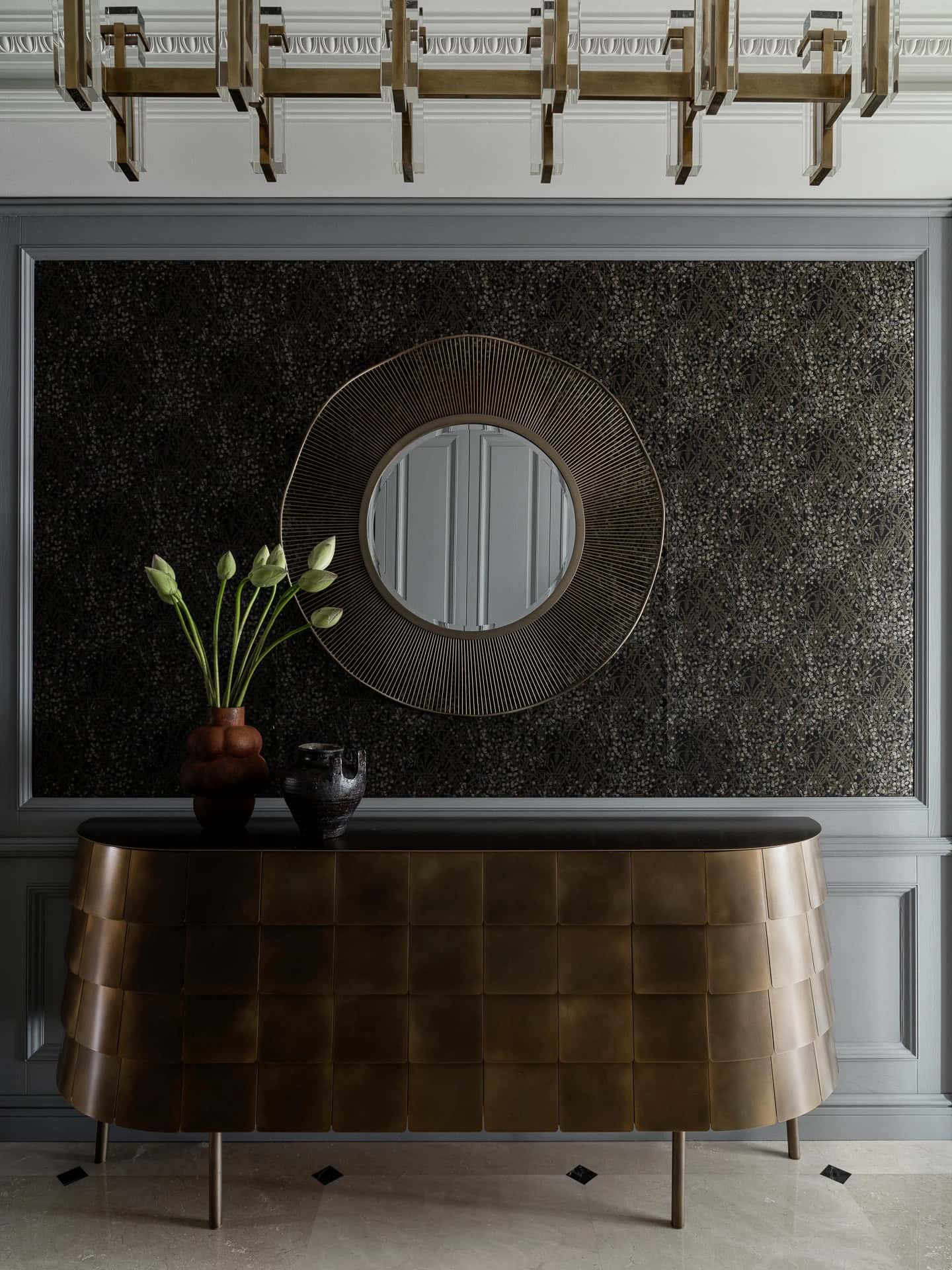 Apartment with a Parisian Mood for Collectors Hallway Console Mirror by AABA Architects Bronze console with round mirror and sculptural decor — AABA Architects, Moscow