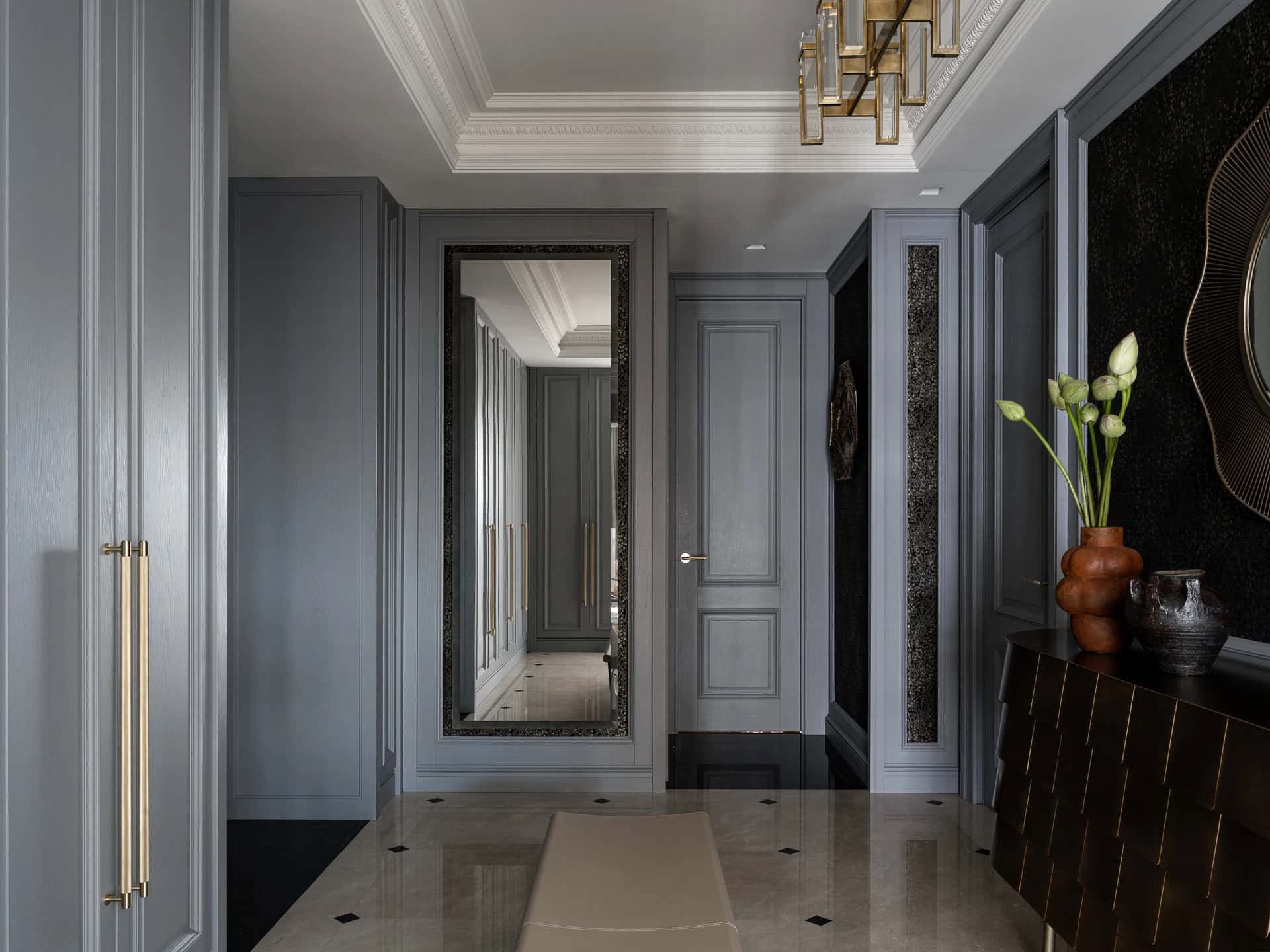 Apartment with a Parisian Mood for Collectors Hallway Mirror by AABA Architects Elegant gray hallway with large mirror and brass details — AABA Architects, Moscow