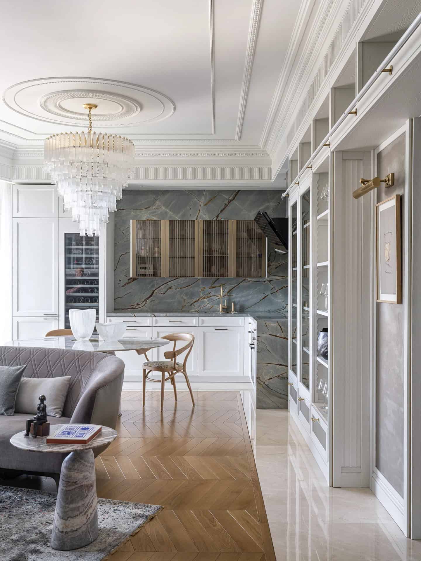 Apartment with a Parisian Mood for Collectors Kitchen–Living Chandelier by AABA Architects Kitchen–living space with chandelier in the Apartment with a Parisian Mood for Collectors by AABA Architects, Moscow