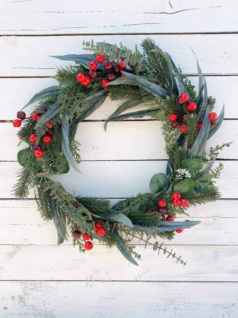 Minimal evergreen and eucalyptus Christmas wreath with red berries
