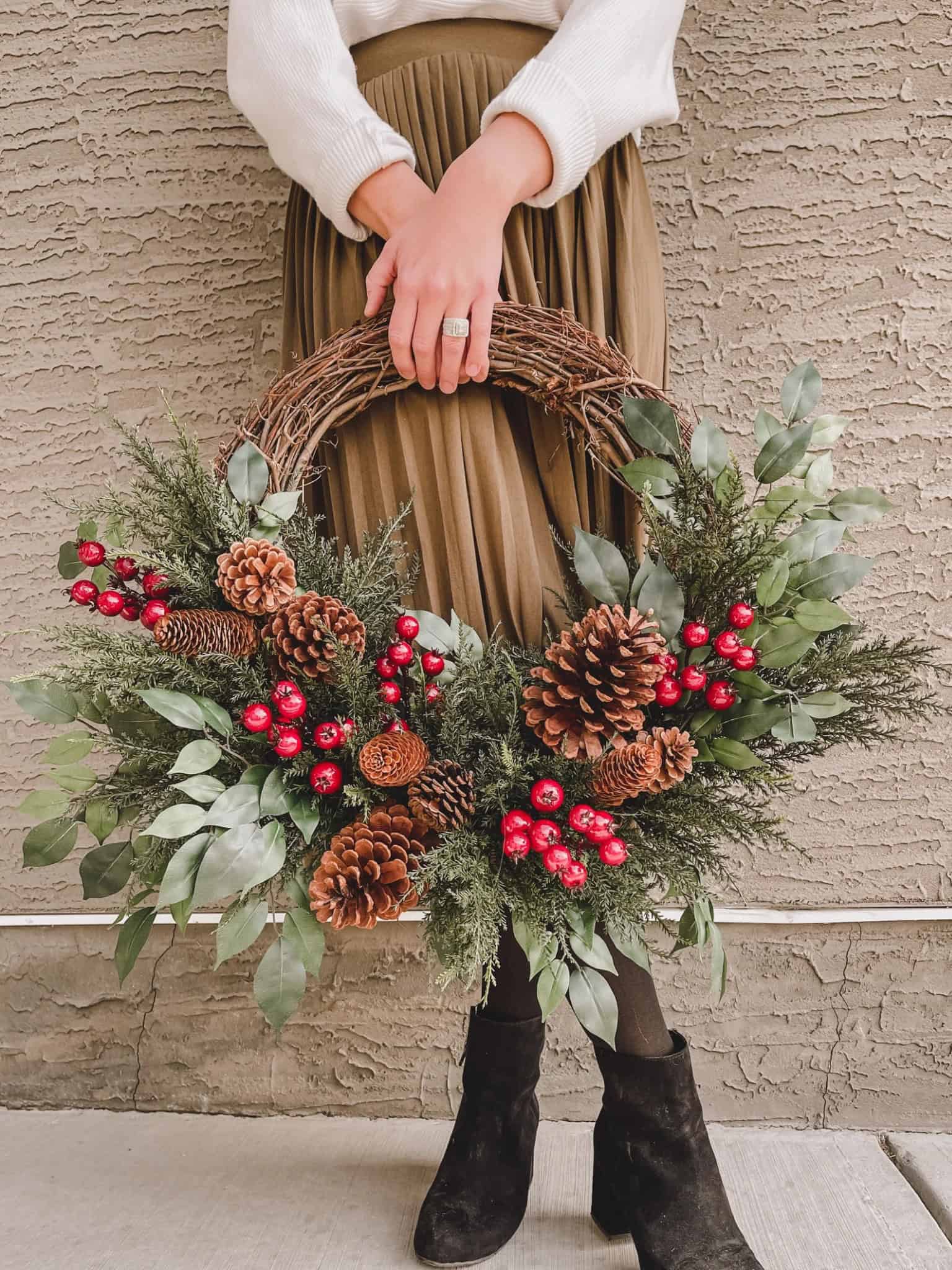 Handcrafted Christmas wreath with greenery and bright red berries