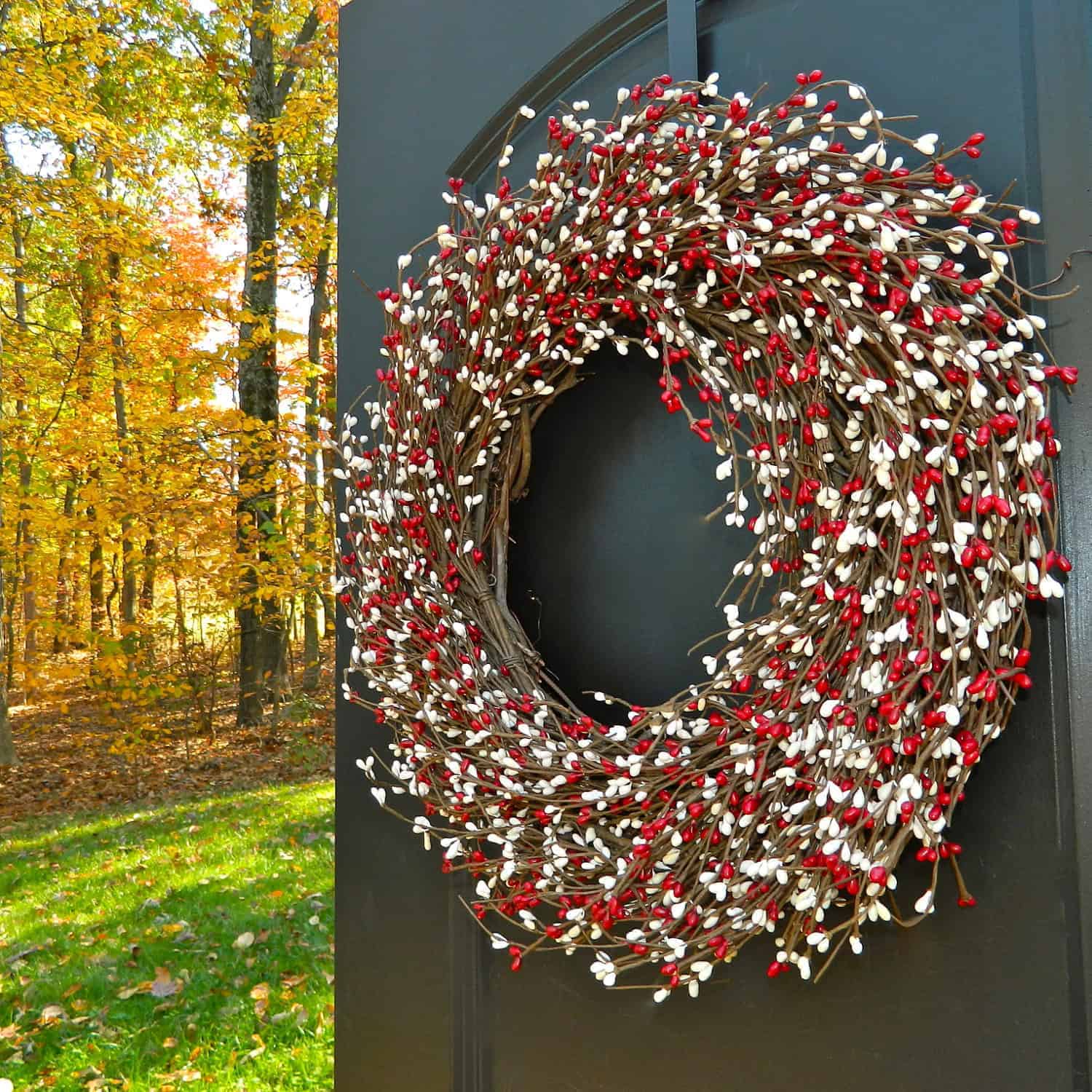 Rustic twig Christmas wreath with red and white berries