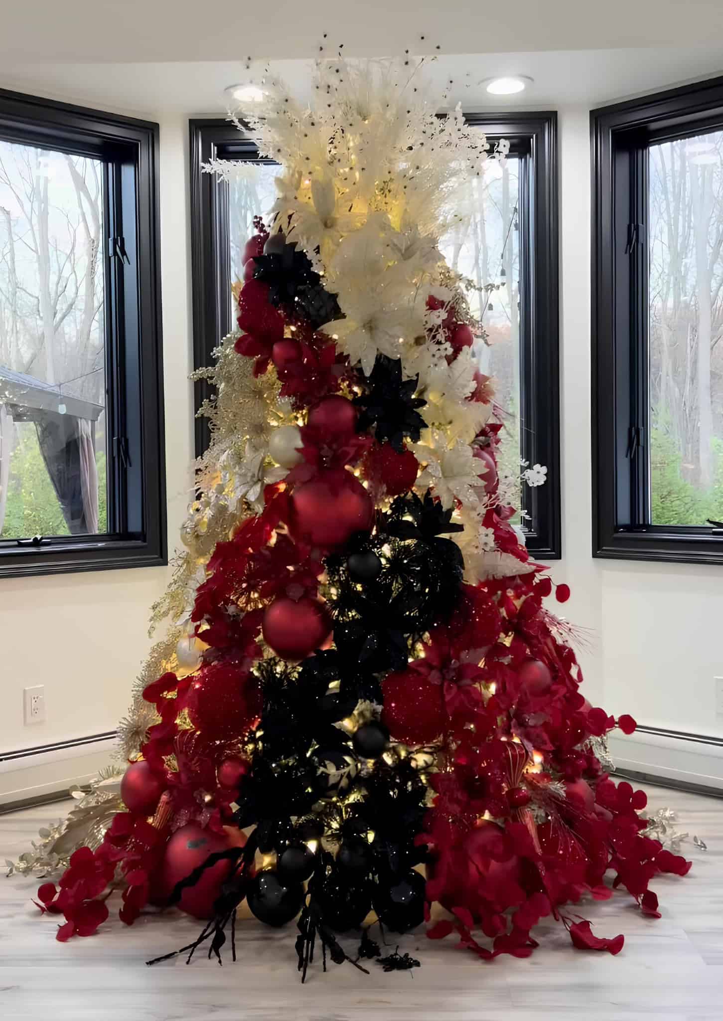 Modern Christmas tree with black, red, and white ornaments in a bold color scheme