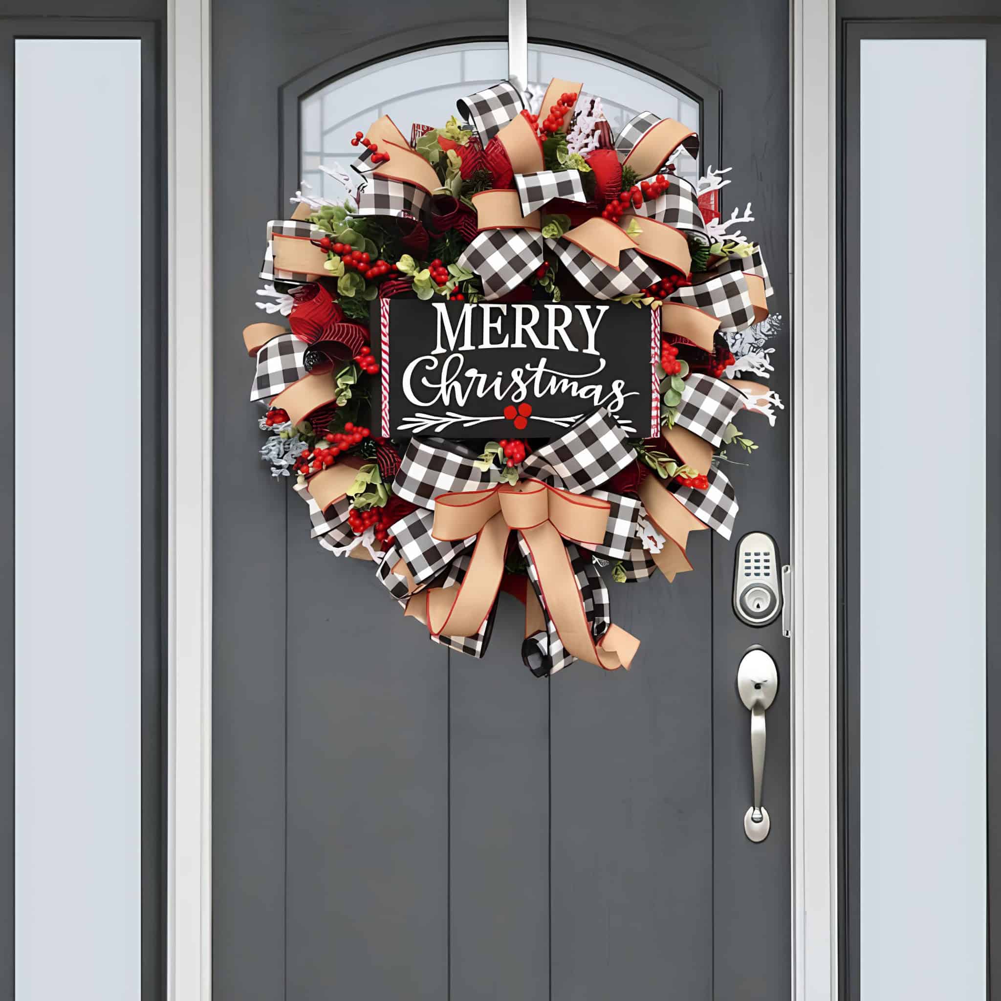 Large ribbon wreath with buffalo plaid bows and Merry Christmas sign hung on a gray door