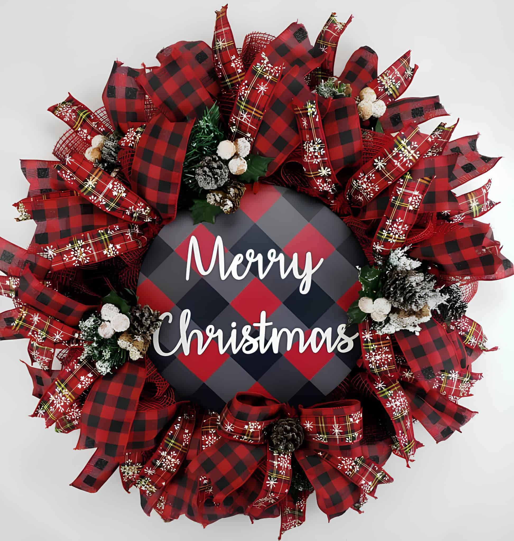 Red and black buffalo plaid ribbon wreath with pinecones and snowflake accents
