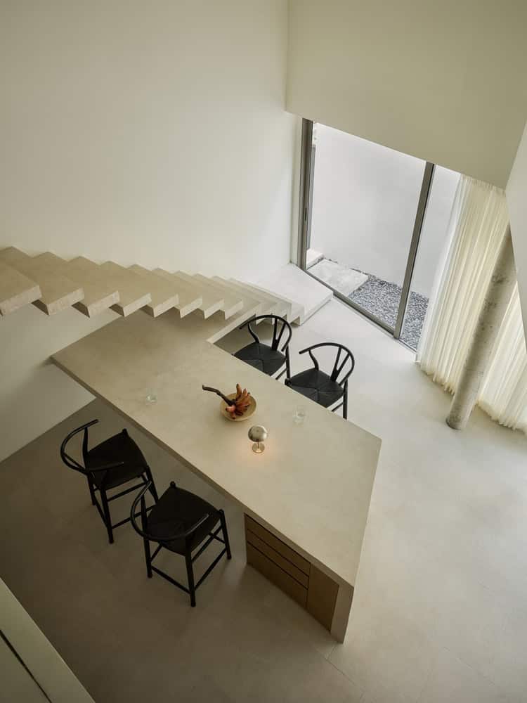 Casa T Dining Aerial View by SSAA Casa T by SSAA, aerial view of minimalist dining and stair space in Bangkok, Thailand