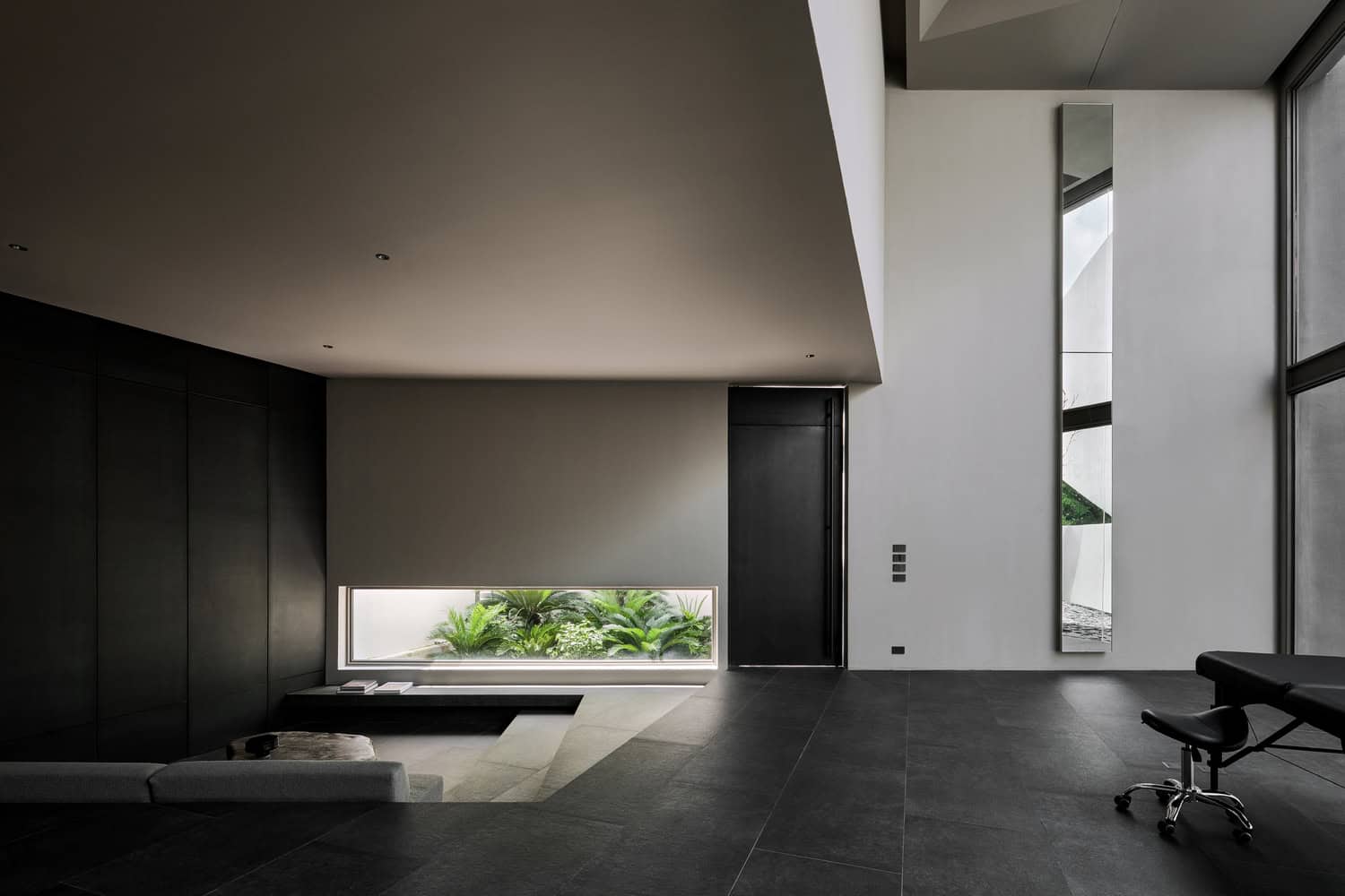 Casa T Living Garden View by SSAA Casa T by SSAA, minimalist living area with garden window in Bangkok, Thailand