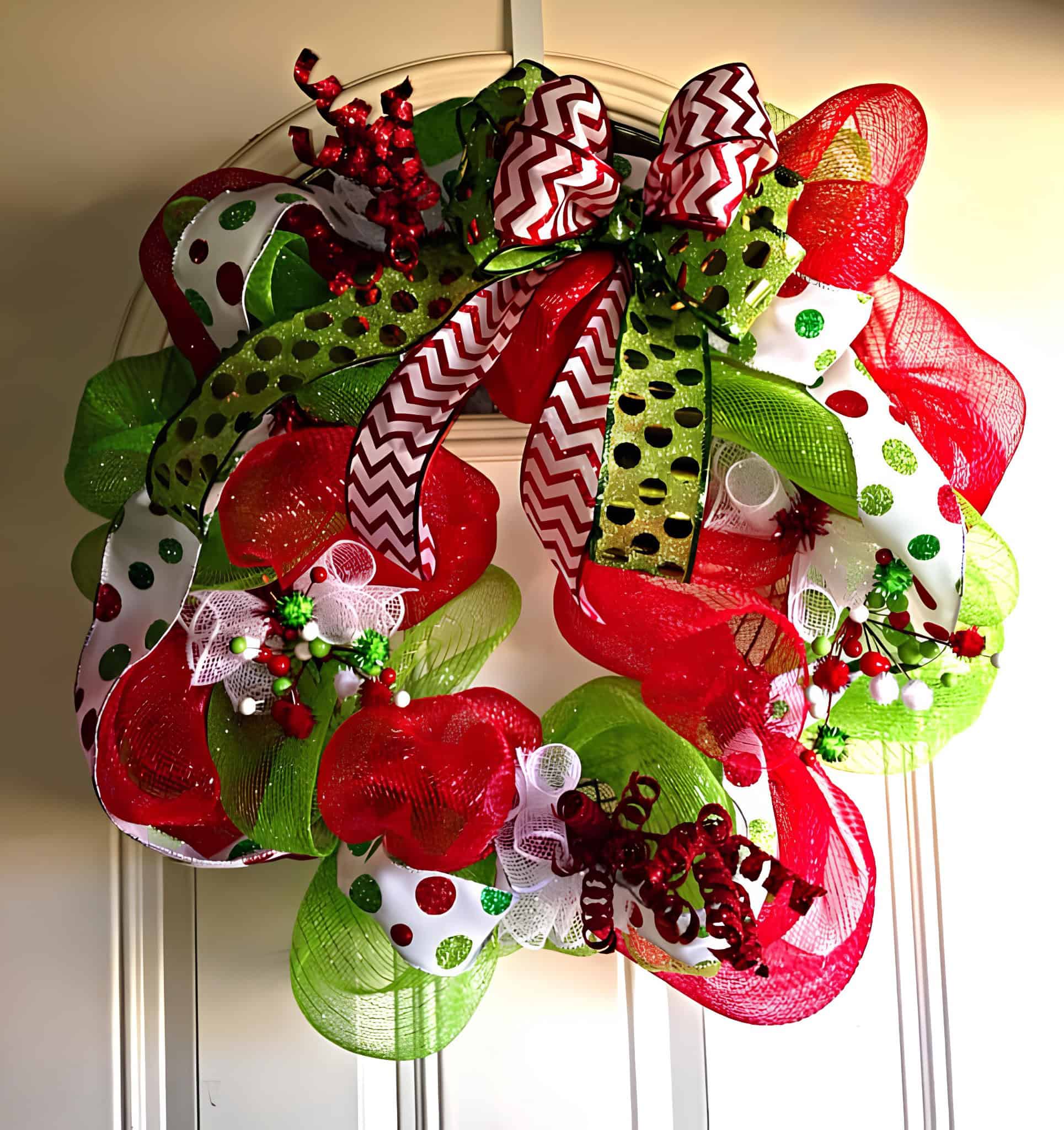 Deco mesh wreath with chevron and polka dot ribbons in red, green and white