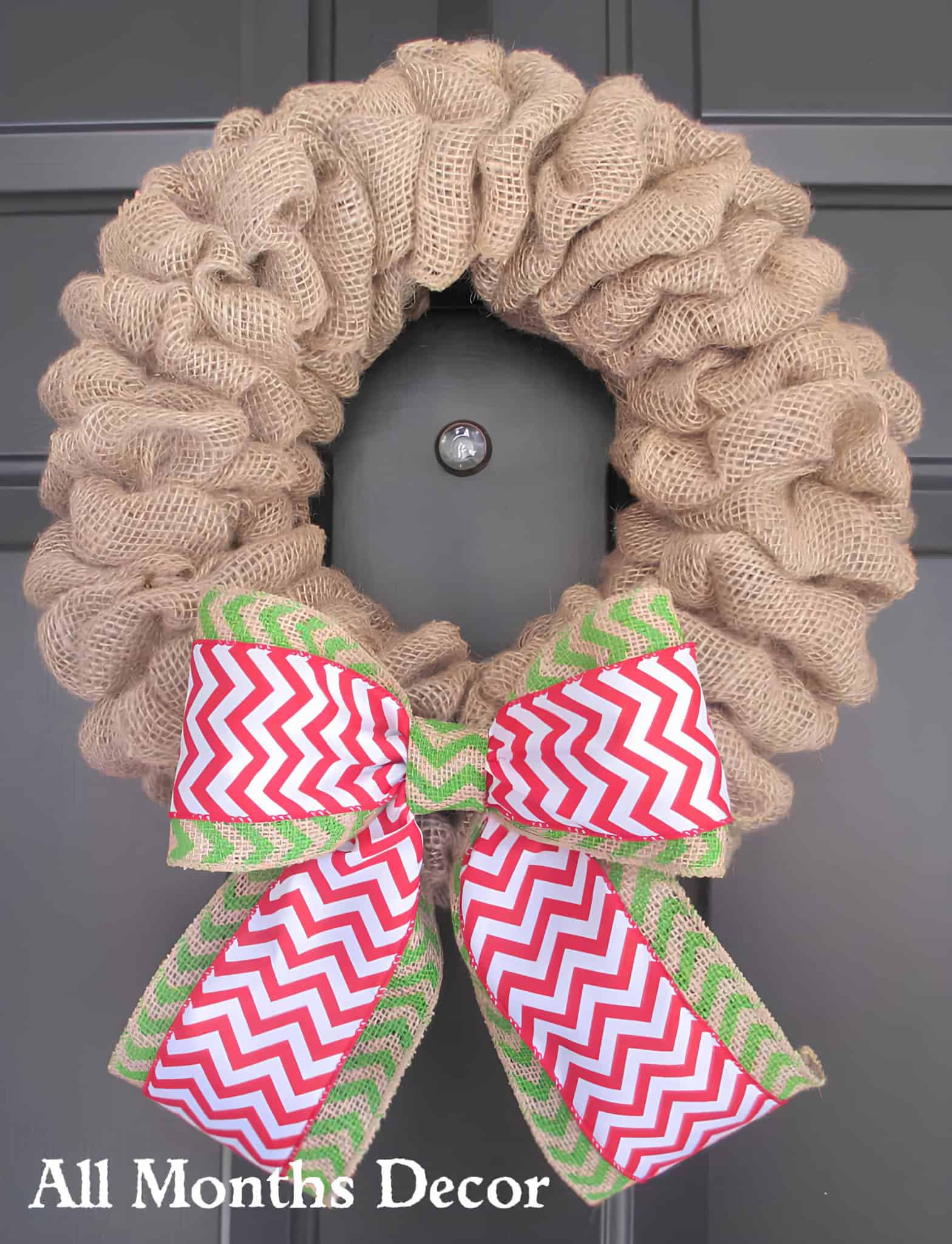Rustic burlap wreath with red and green chevron ribbon bow