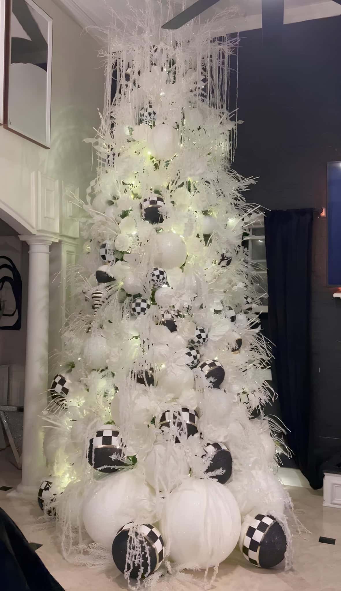 Black and white checkered Christmas tree with modern ornaments and icicle accents