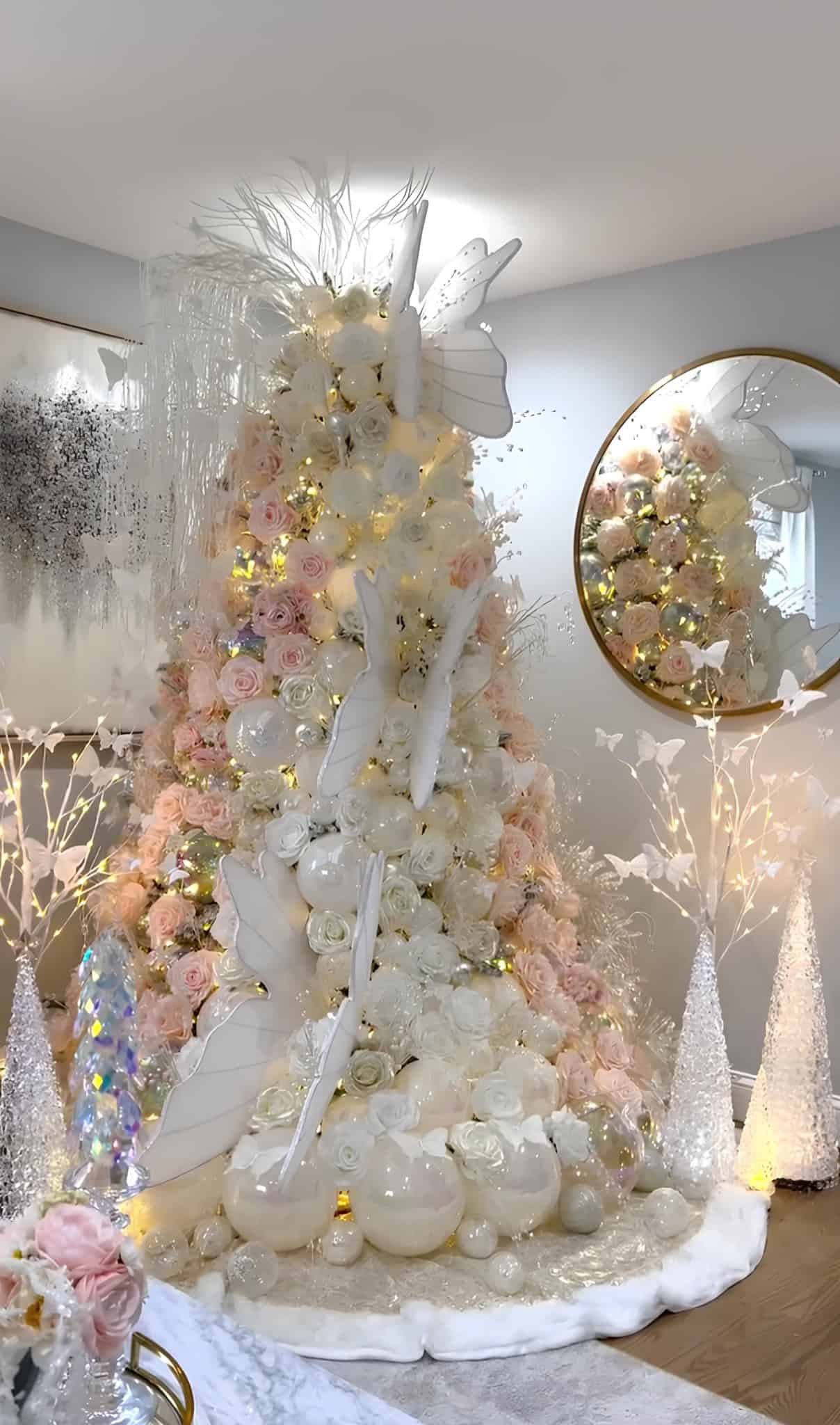 Romantic blush and white rose Christmas tree with sculptural butterfly accents