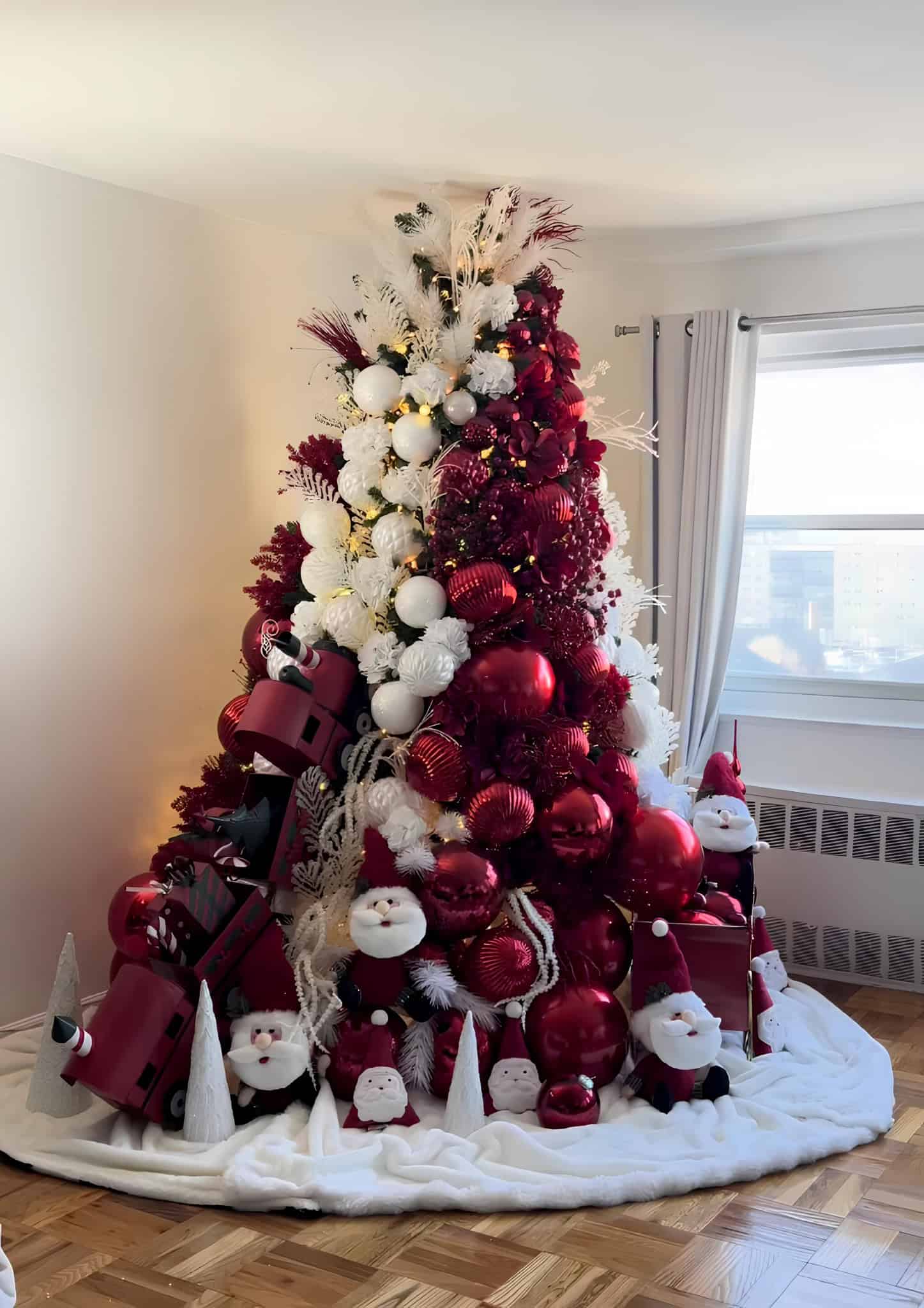 Burgundy and white Christmas tree with Santa accents, oversized baubles, and feathery picks