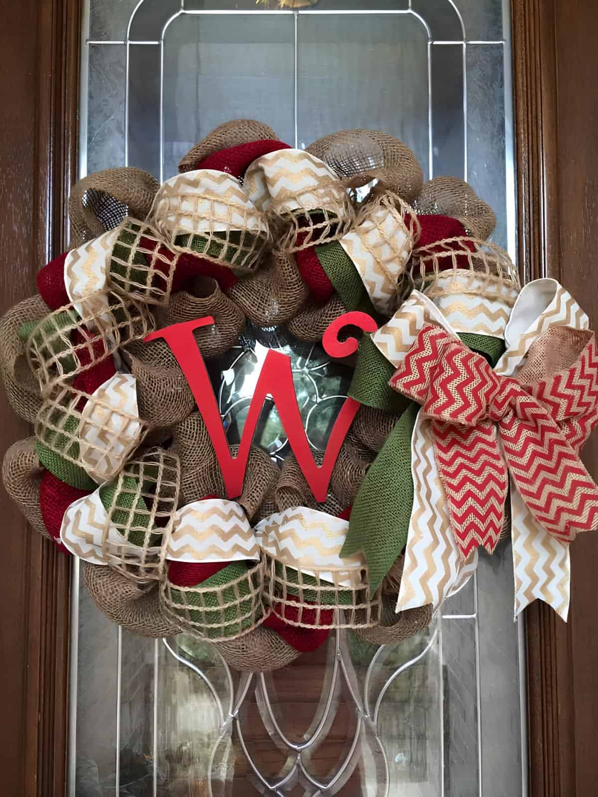 Rustic burlap Christmas wreath with red monogram letter W and ribbon bow