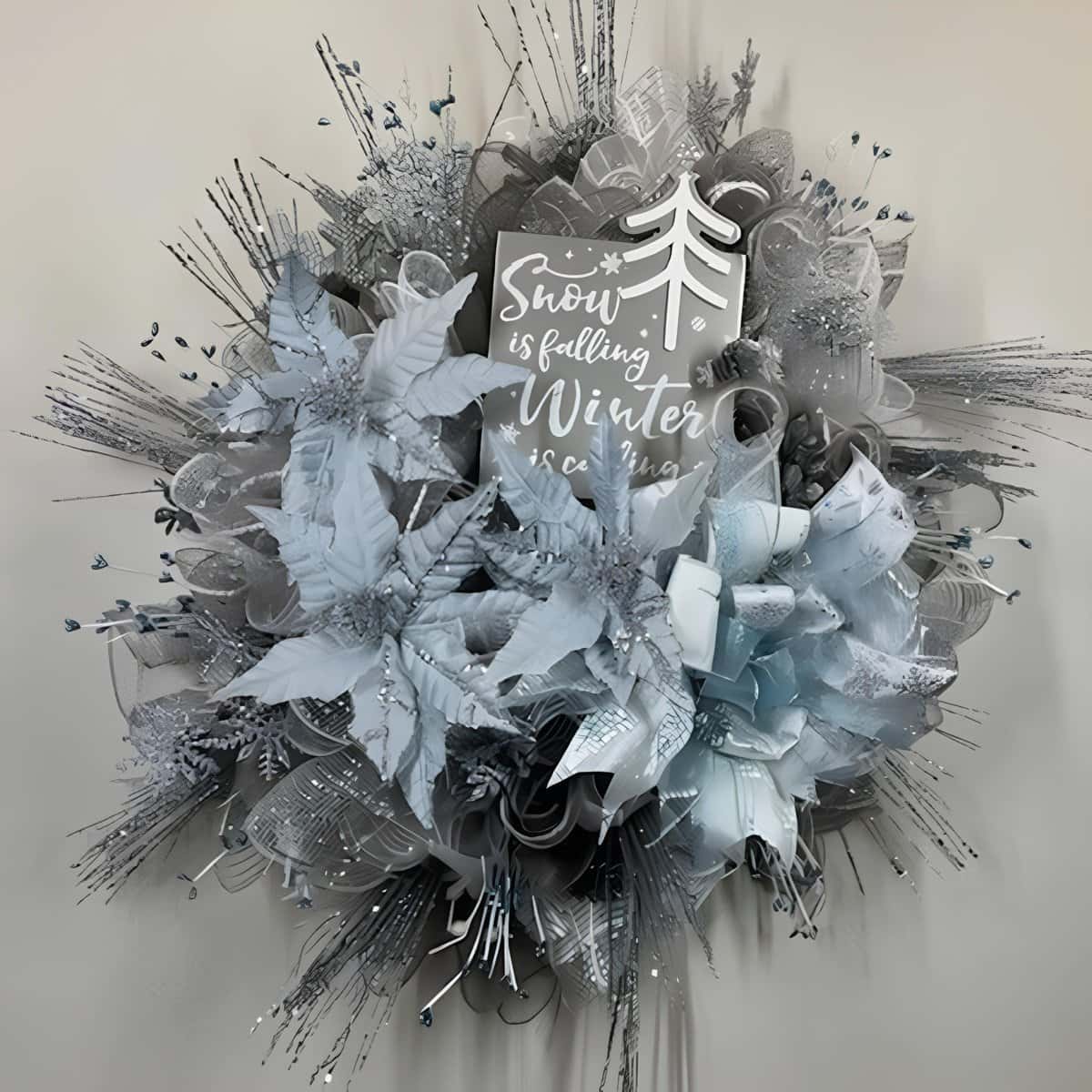 Silver and white Christmas wreath with snowflakes and poinsettias