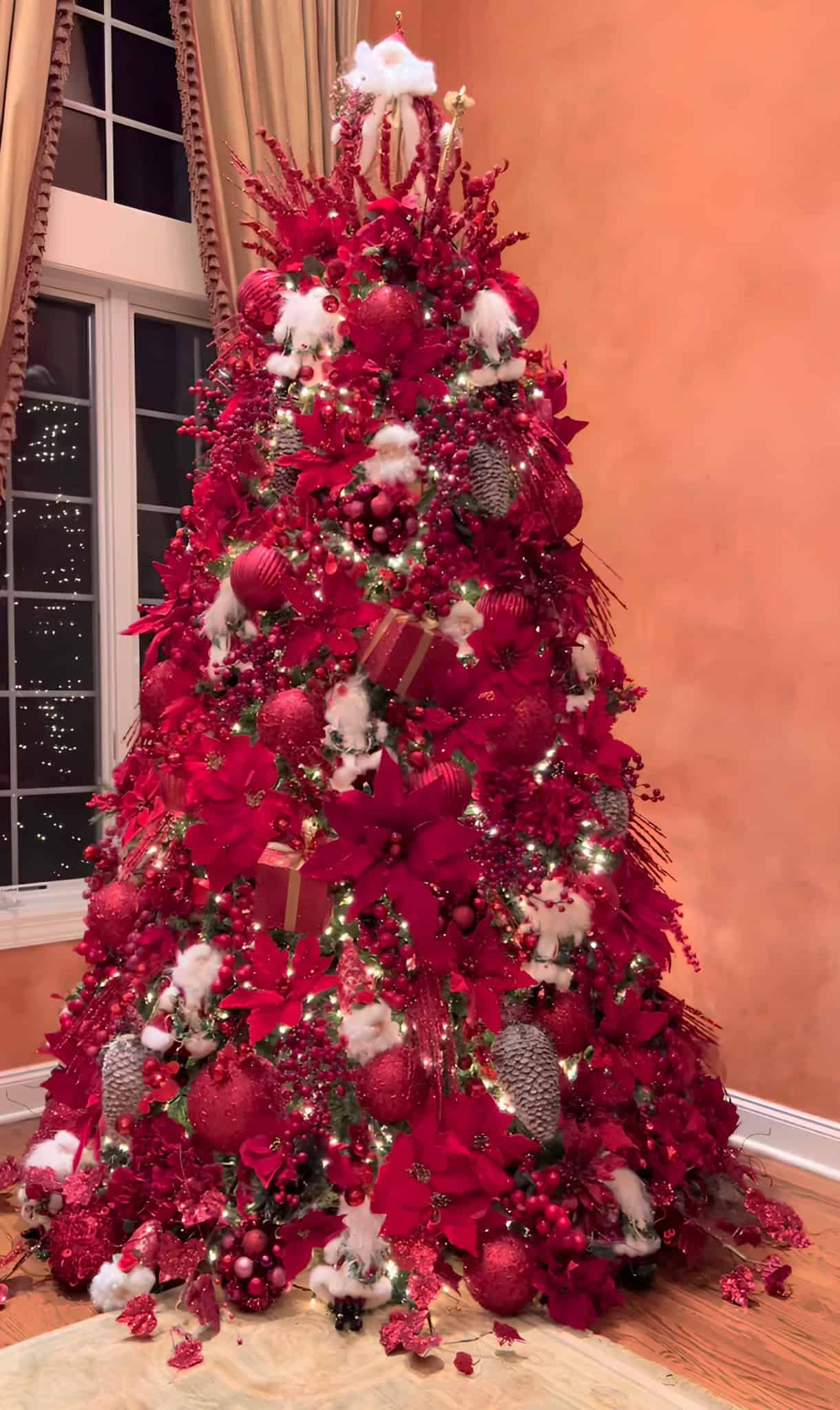 Classic red Christmas tree with Santa ornaments and festive details