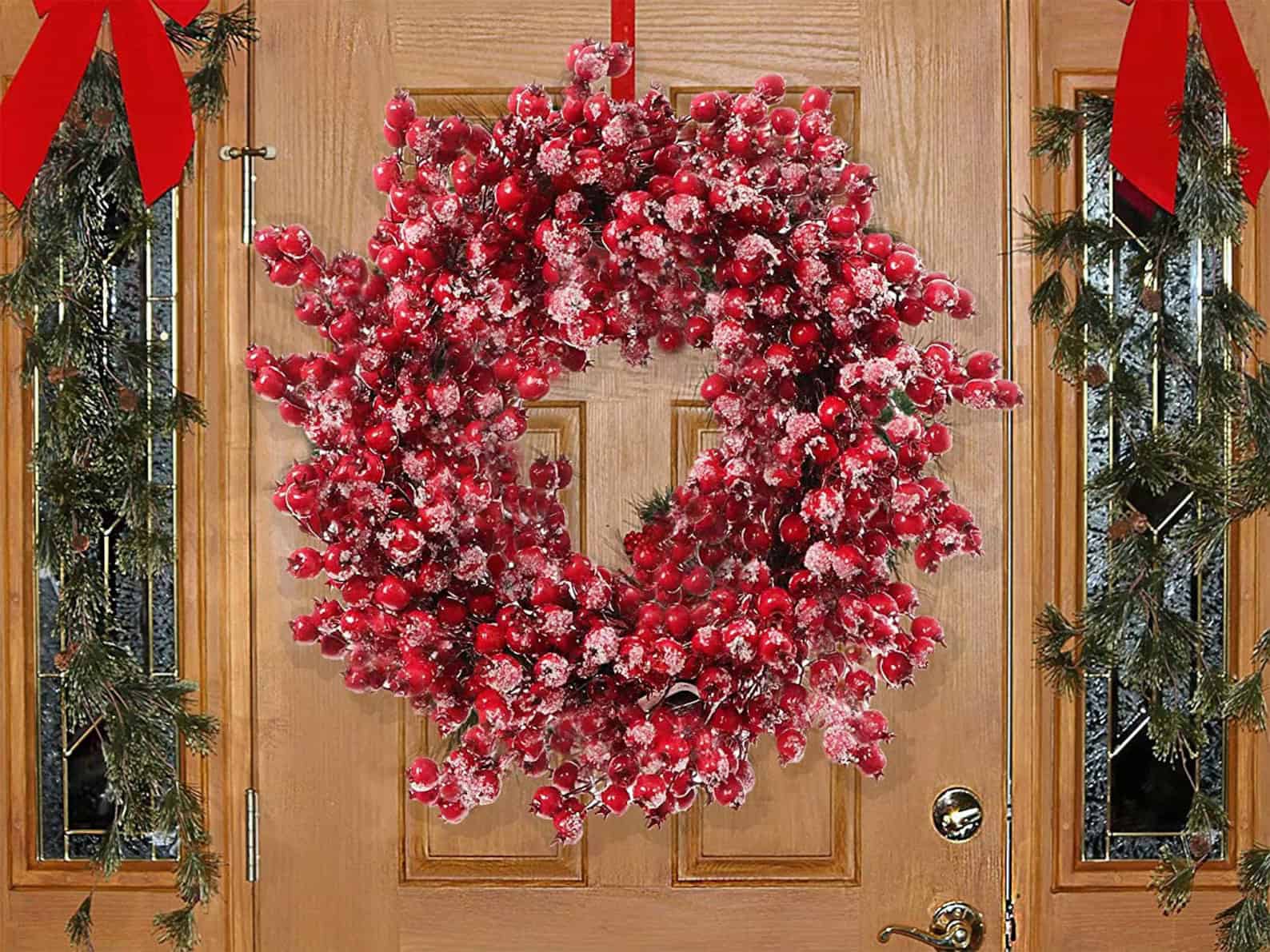 Frosted red berry Christmas wreath with snow effect