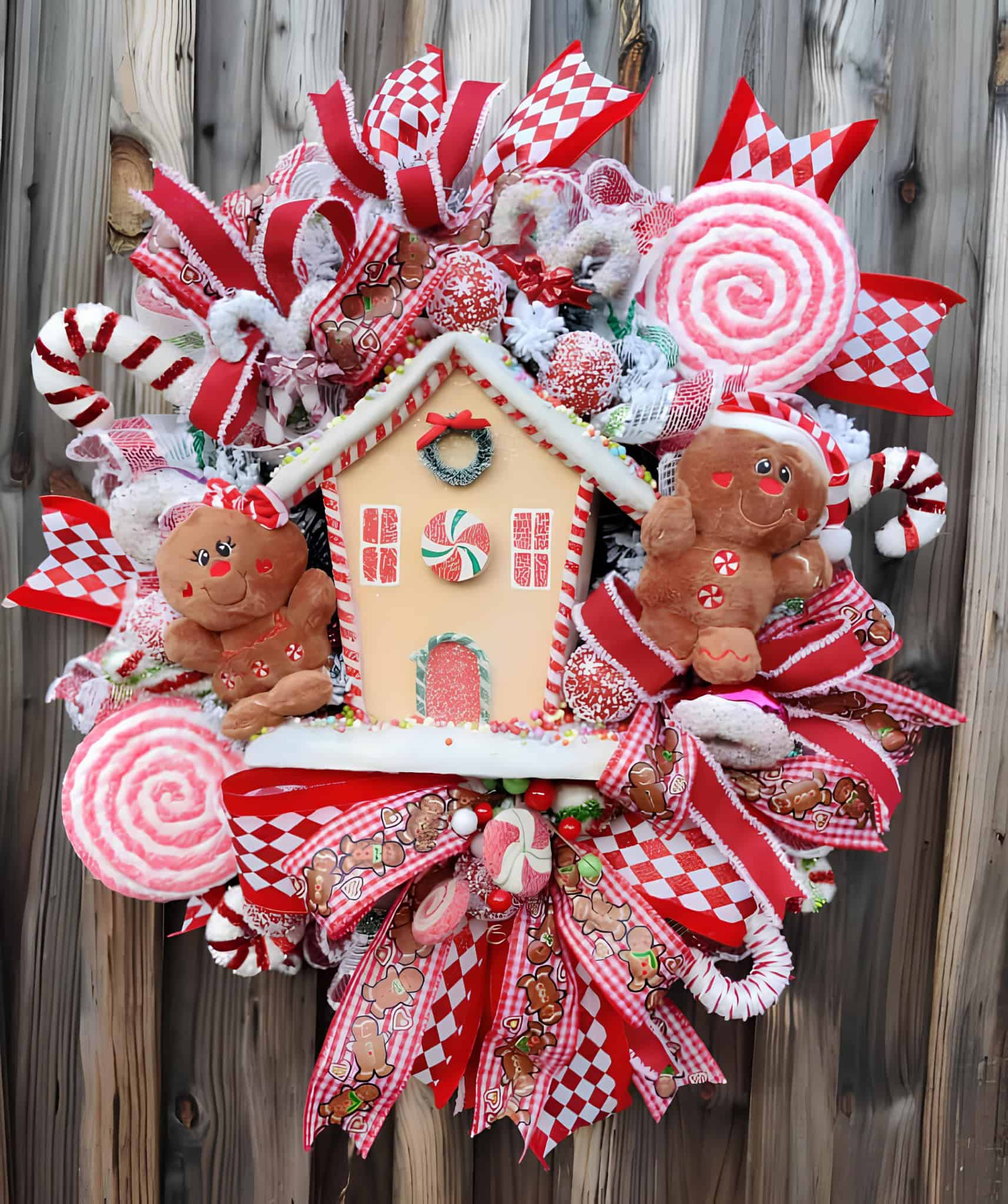 Whimsical ribbon wreath with gingerbread house, candy canes and gingham bows