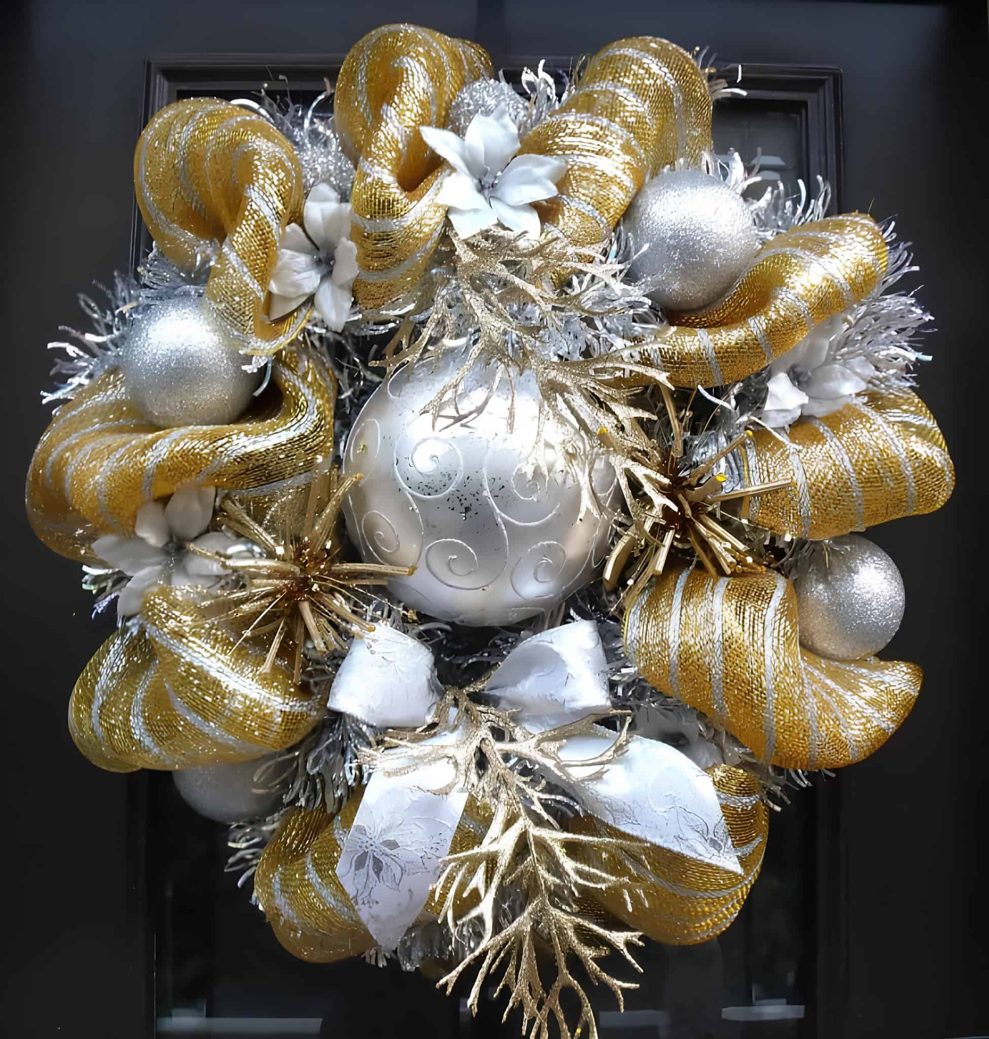 Gold and silver mesh Christmas wreath with a large centerpiece ornament