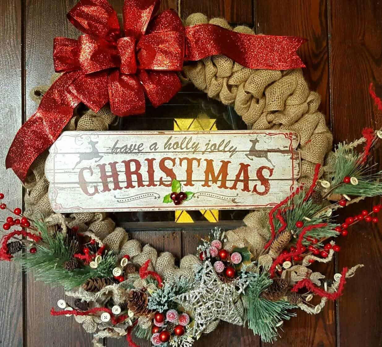 Burlap Christmas wreath with glitter red bow and holly jolly sign