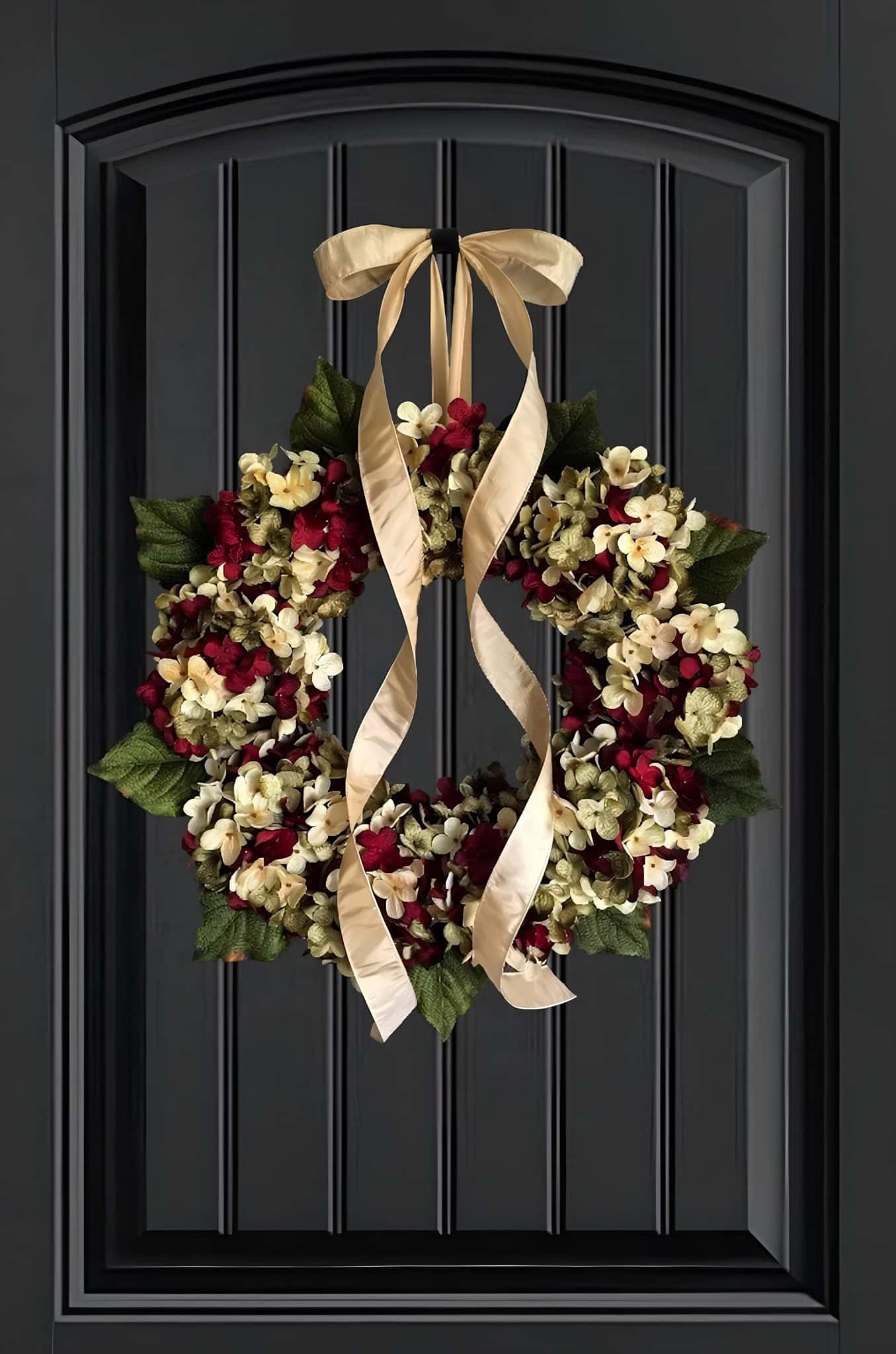 Luxe hydrangea Christmas wreath in cream, wine and olive with a flowing champagne ribbon