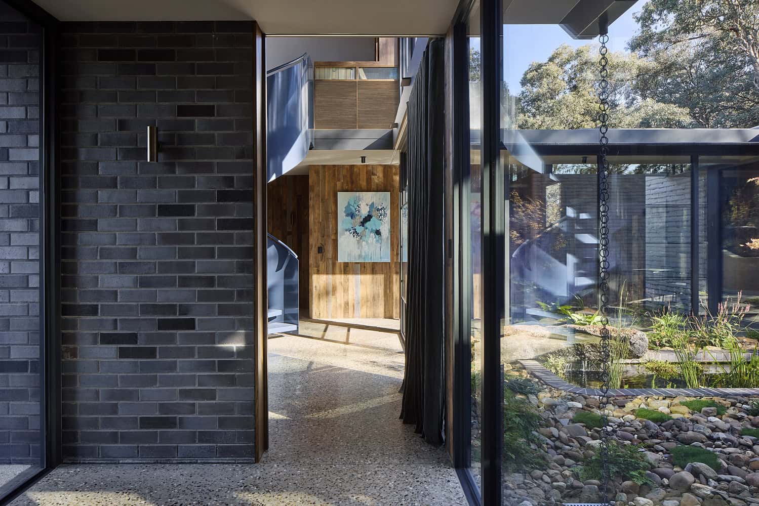 Korinda House Corridor Courtyard Pond by Bent Architecture Korinda House by Bent Architecture — corridor with views to courtyard pond, Plenty, Victoria