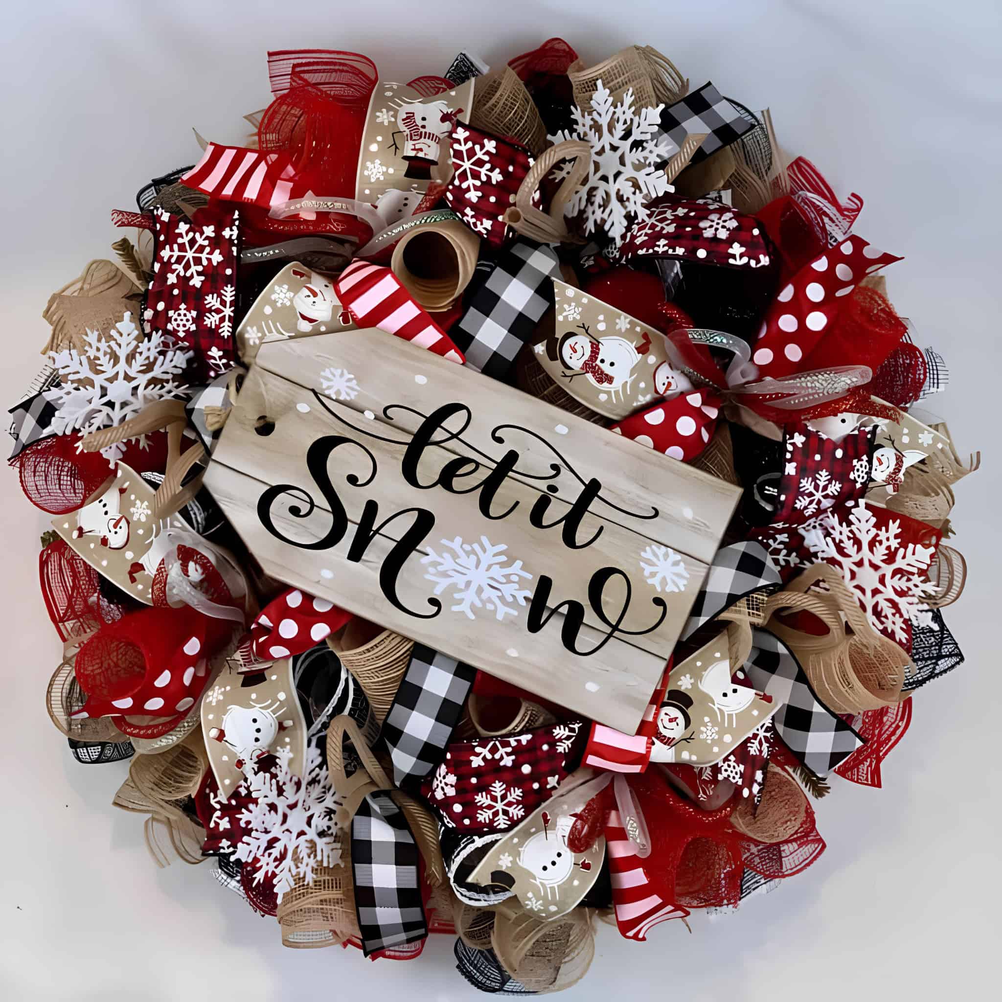 Ribbon wreath in red, black and tan with Let It Snow sign and snowflake accents
