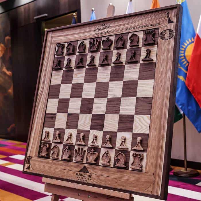 A premium vertical wall-hanging chessboard by ChessboArt, displayed as functional art in an interior design or gallery setting.