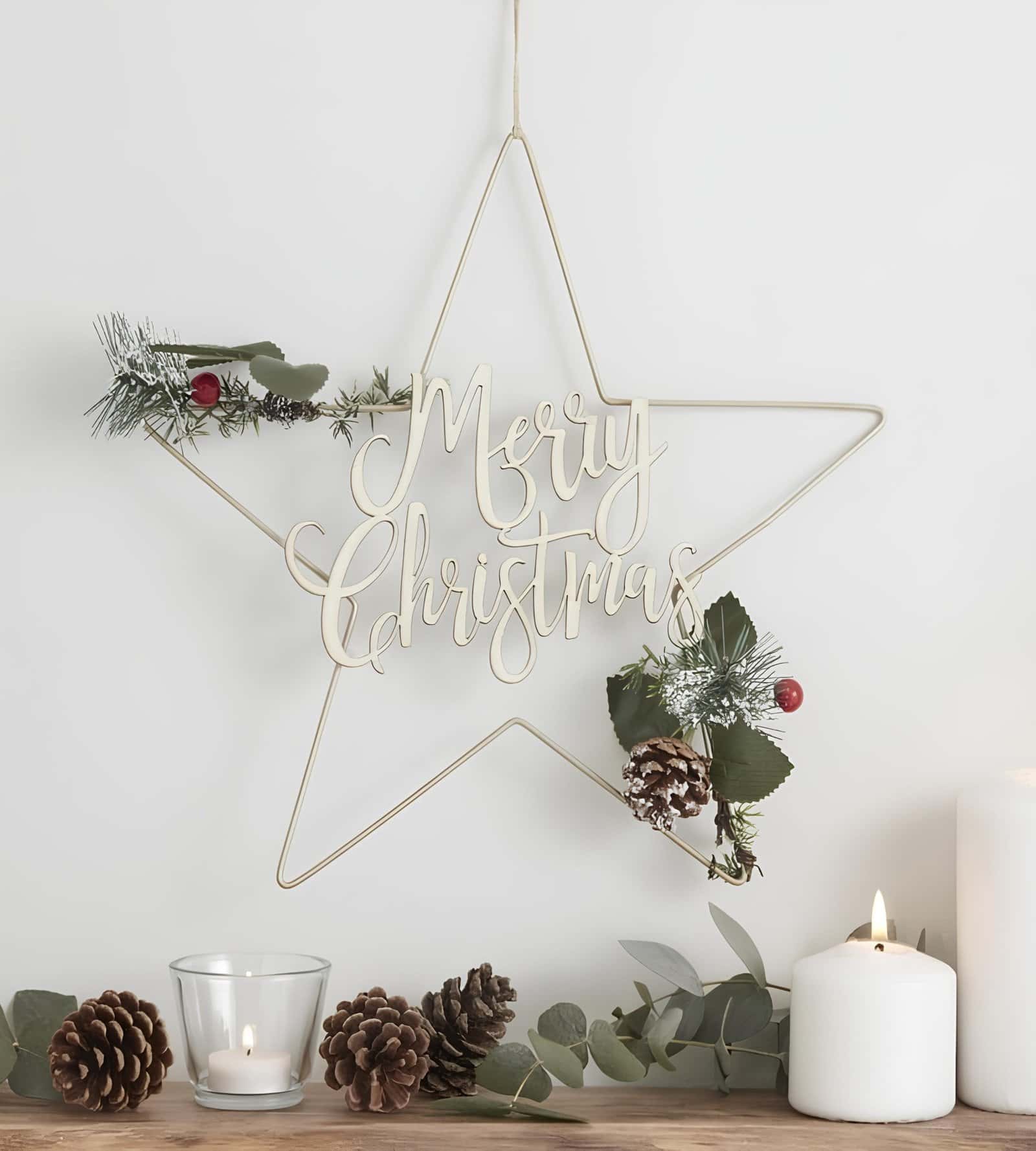 Modern Christmas wreath made from folded geometric paper shapes with a hanging ornament