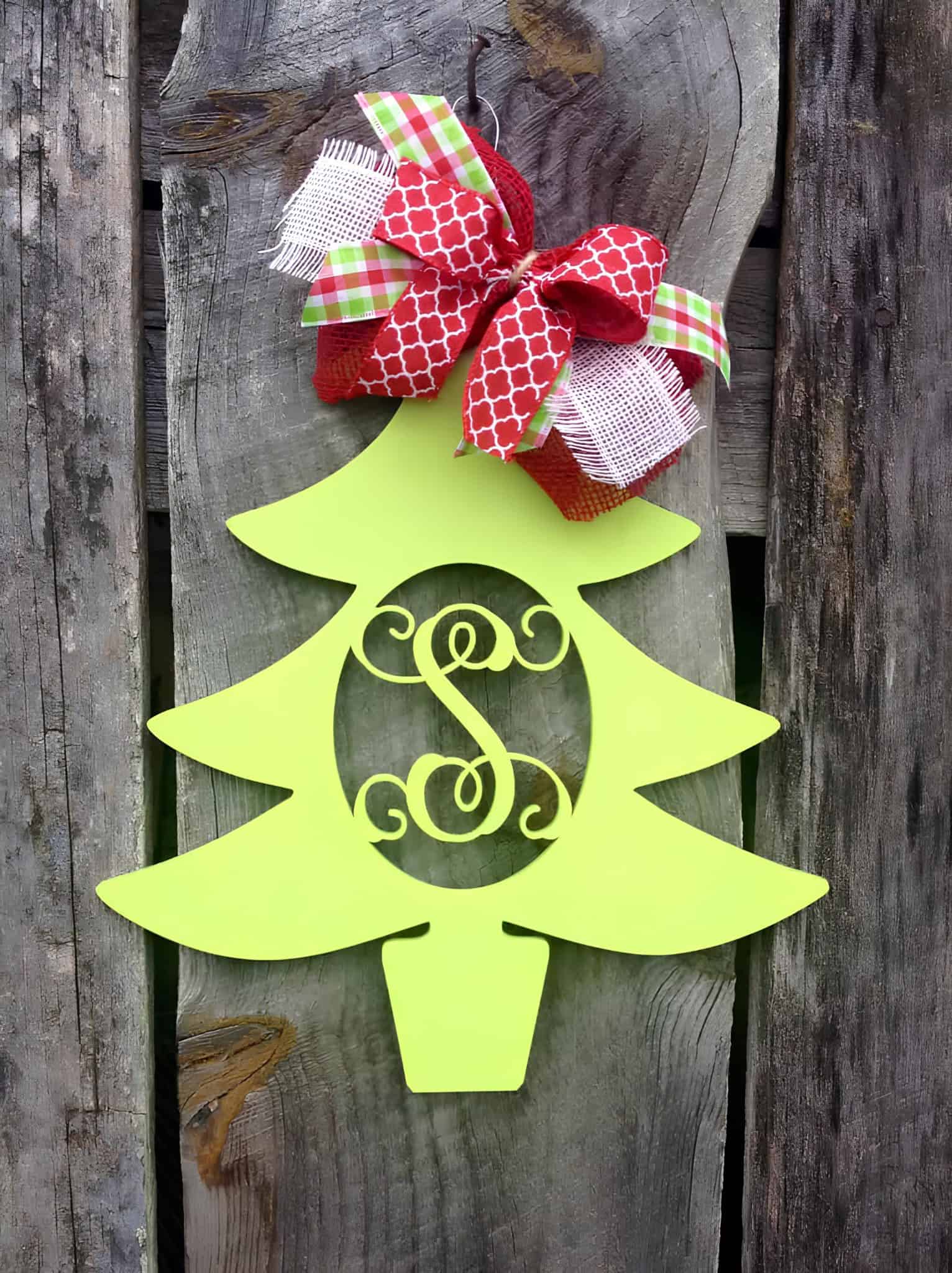Green Christmas tree door hanger with red plaid and burlap bows