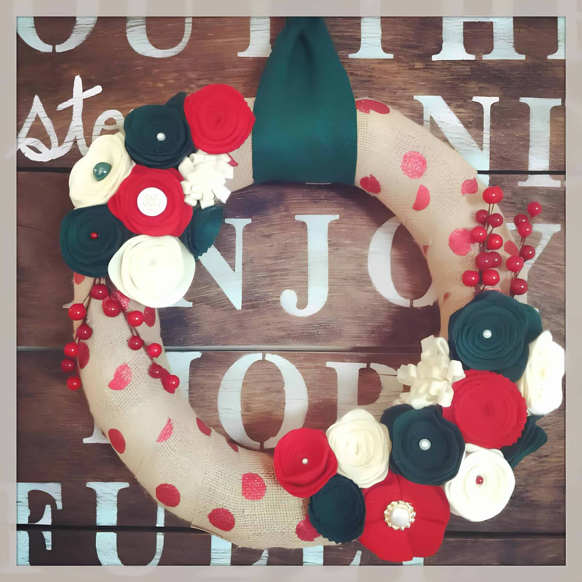 Burlap wreath with red polka dots, felt flowers, and berry accents