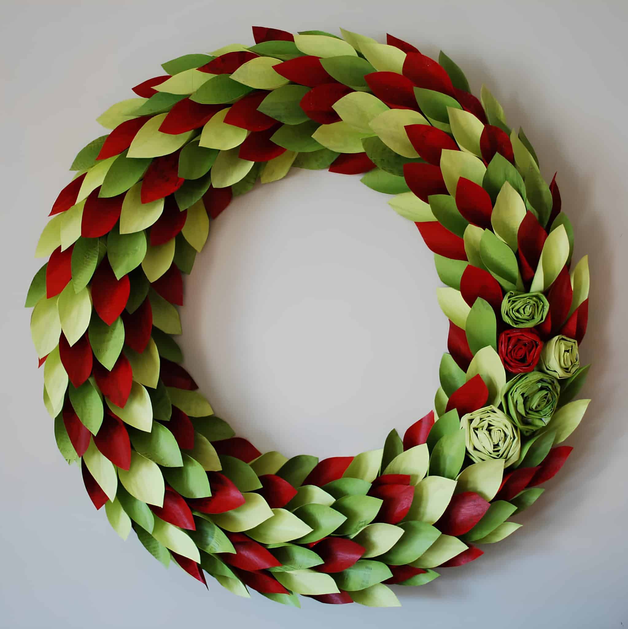 Paper leaf Christmas wreath in red and green with rosette accents