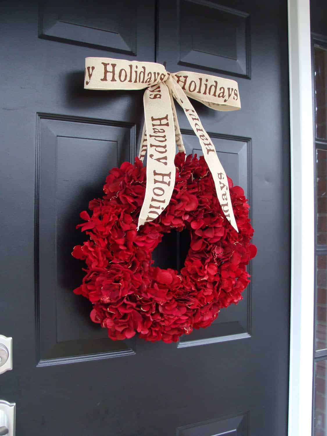 Red hydrangea holiday wreath with Happy Holidays ribbon