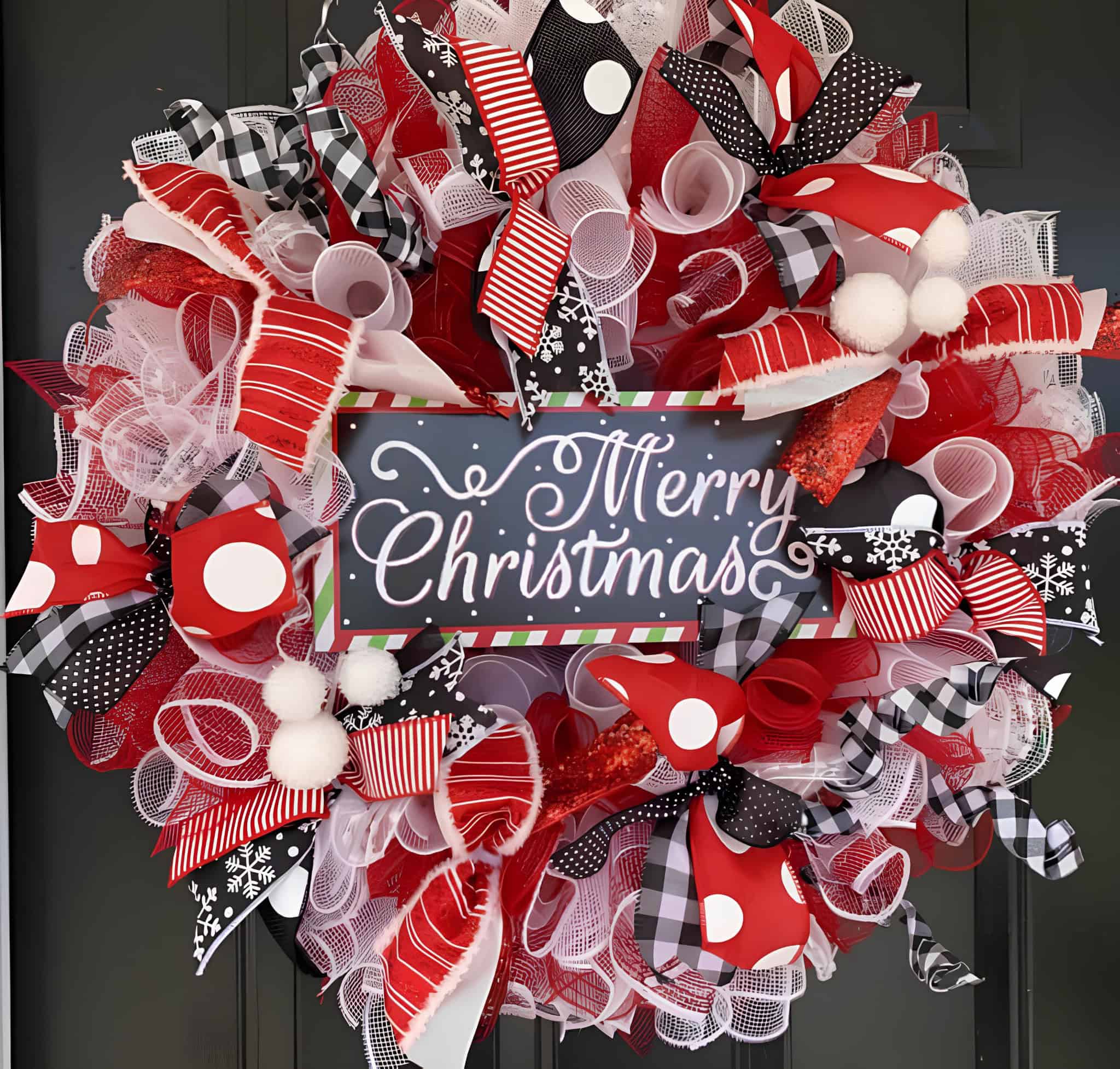 Whimsical ribbon wreath in red, white, and black polka dots with Merry Christmas sign