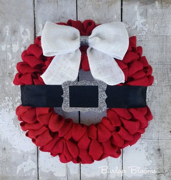Red burlap Christmas wreath with black Santa belt and white bow