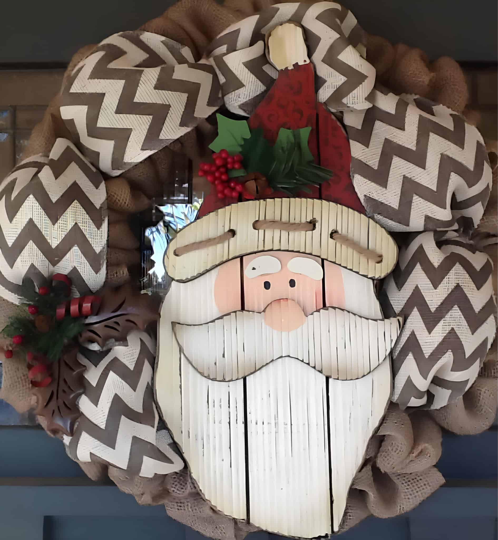 Burlap Christmas wreath with chevron ribbon and a rustic Santa face