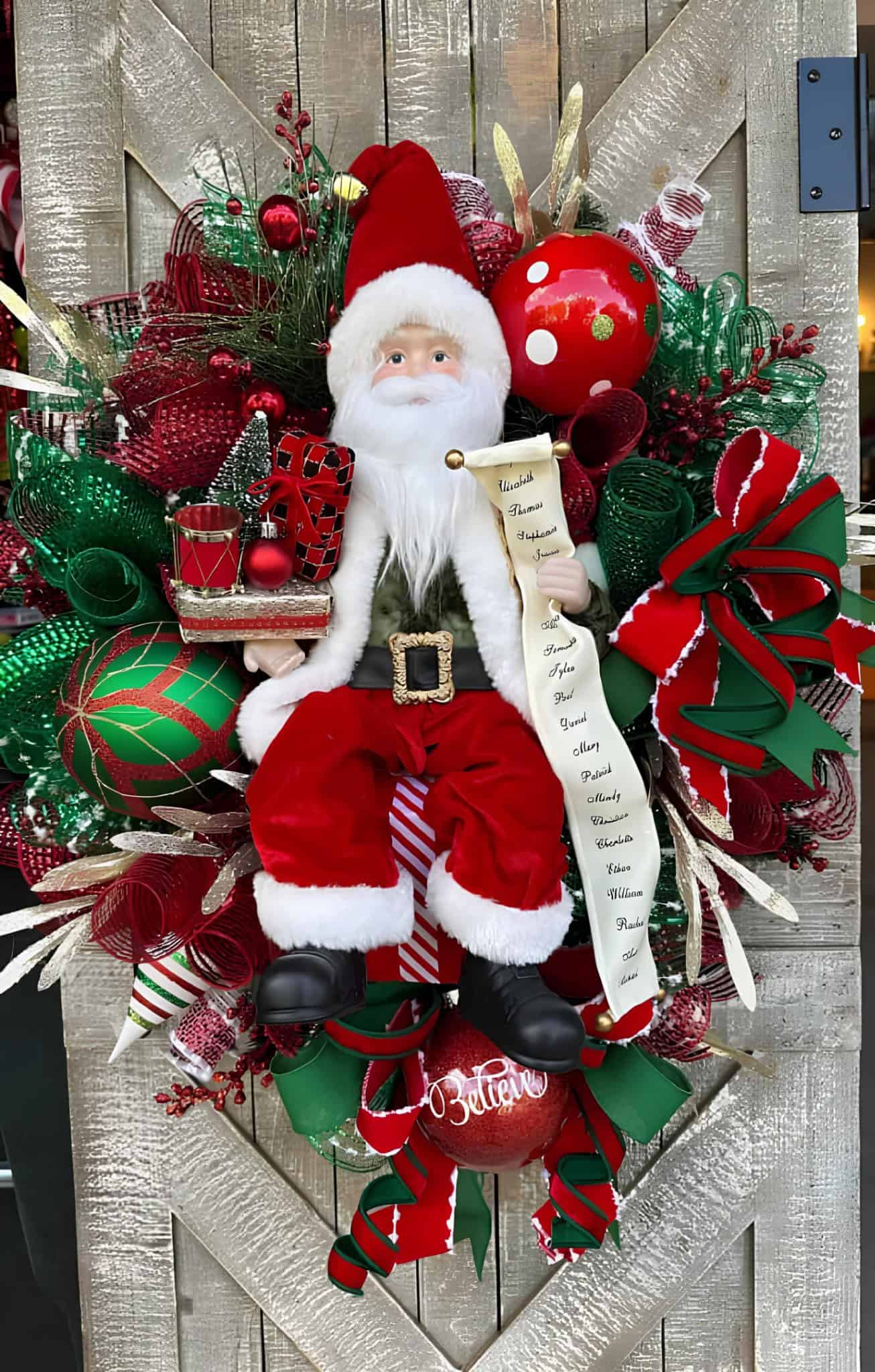 Festive Santa wreath with gift list, red and green mesh, and Christmas ornaments