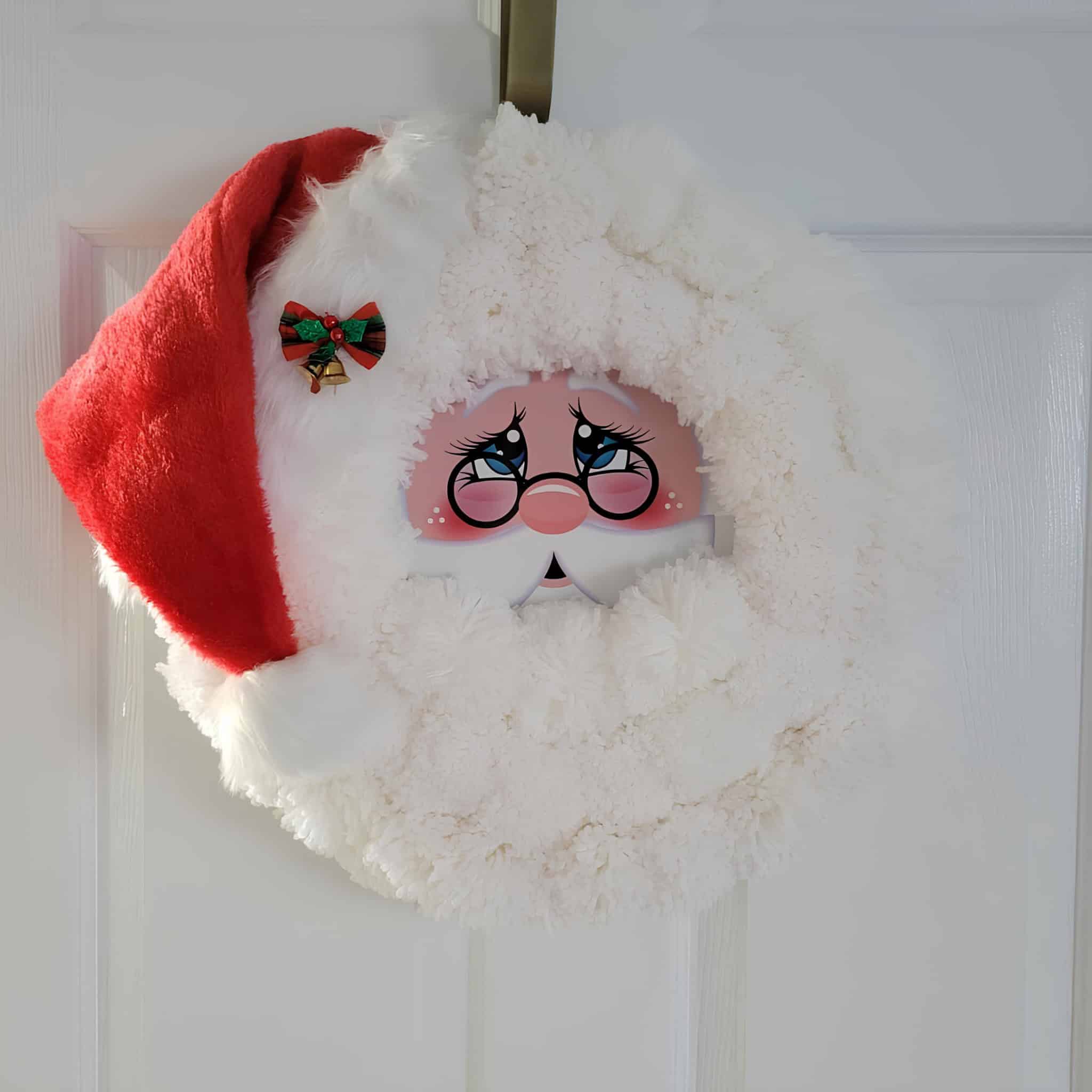 Cozy Santa wreath with plush pom-pom beard and red cap