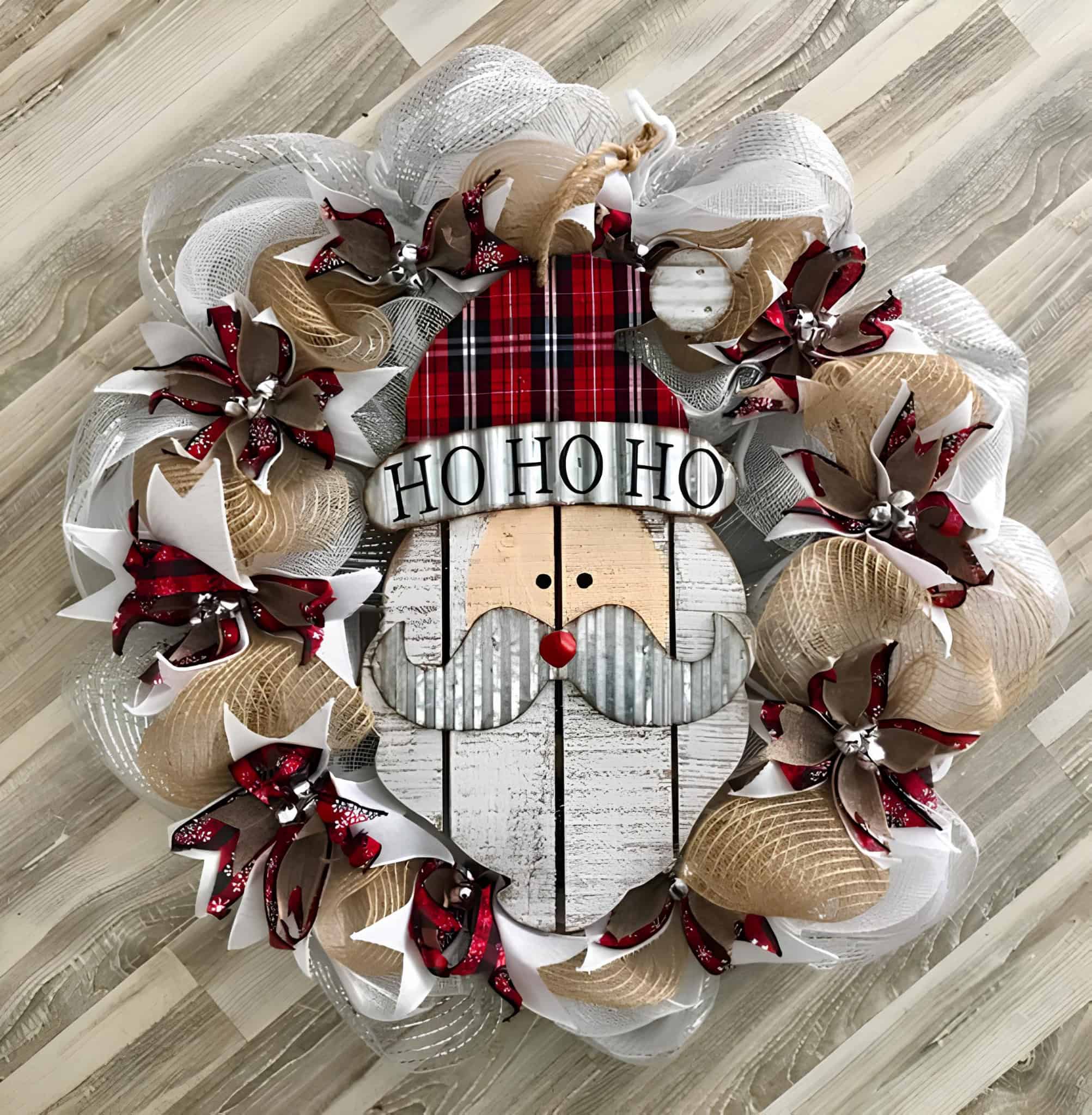 Rustic Santa face wreath with plaid hat, ribbons, and Ho Ho Ho sign