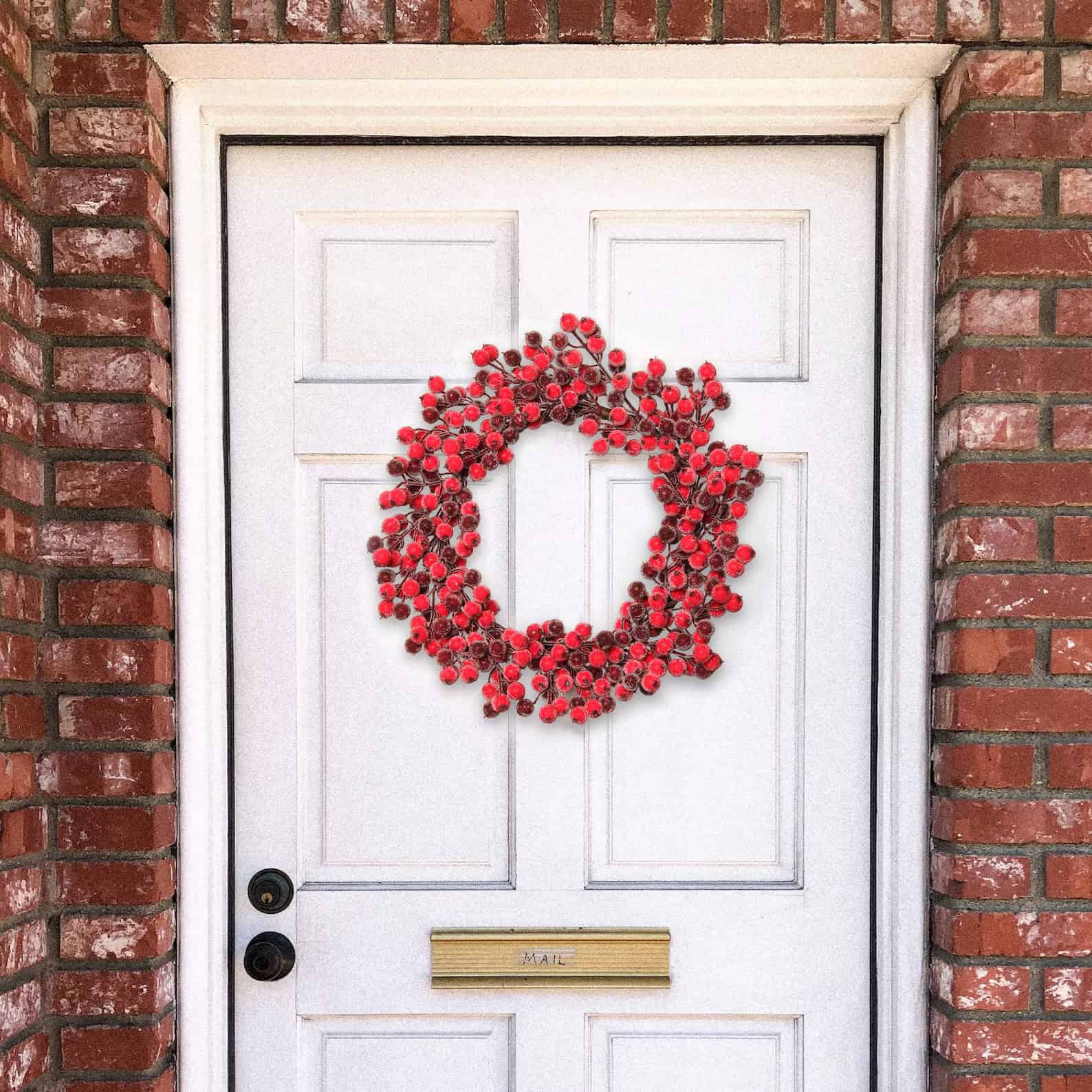 Snowy red berry Christmas wreath for front door