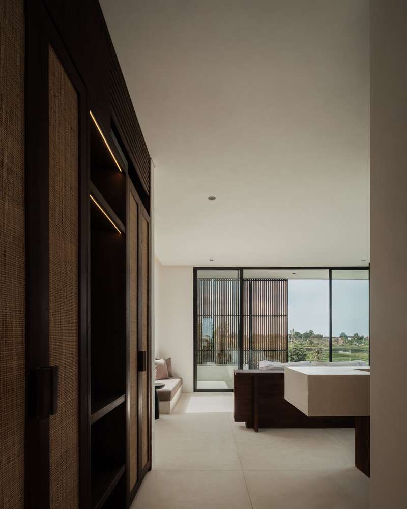Tapa Villa Bedroom Corridor by Studio Tanama Tapa Villa by Studio Tanama bedroom corridor with built-in storage and soft lighting in Bali, Indonesia