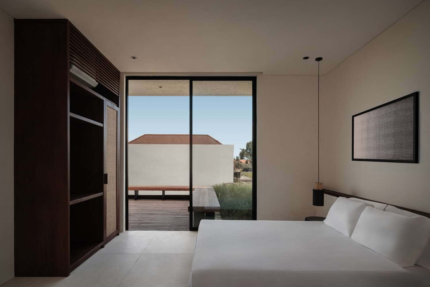 Tapa Villa Bedroom Two by Studio Tanama Tapa Villa by Studio Tanama modern bedroom opening to terrace in Bali, Indonesia