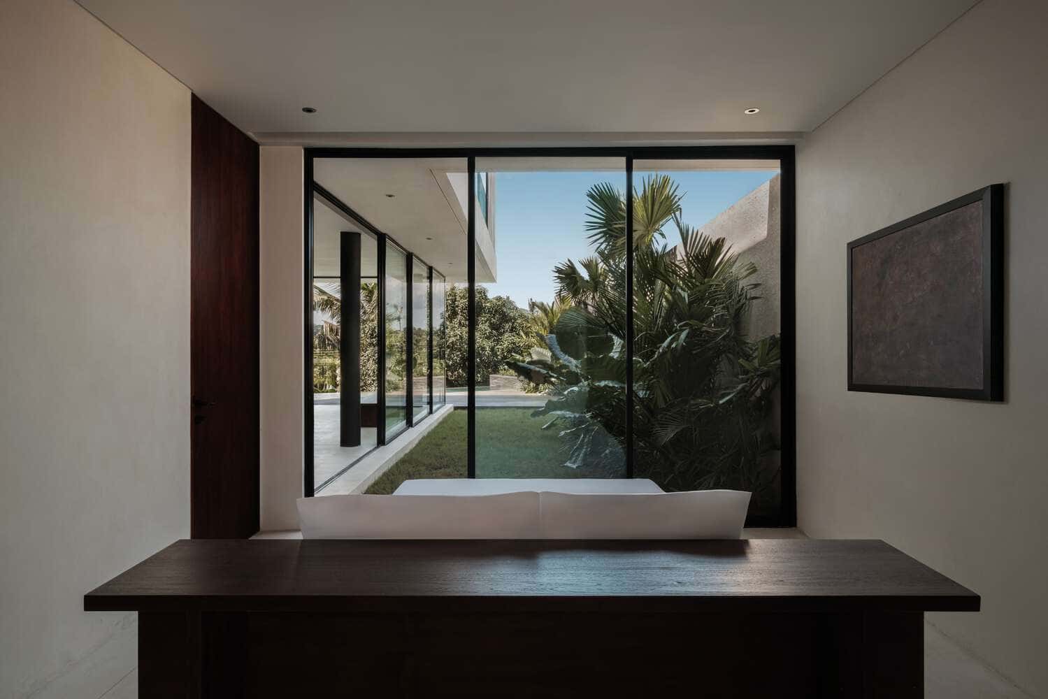 Tapa Villa Courtyard Lounge by Studio Tanama Tapa Villa by Studio Tanama courtyard lounge space connecting to pool and garden in Bali, Indonesia